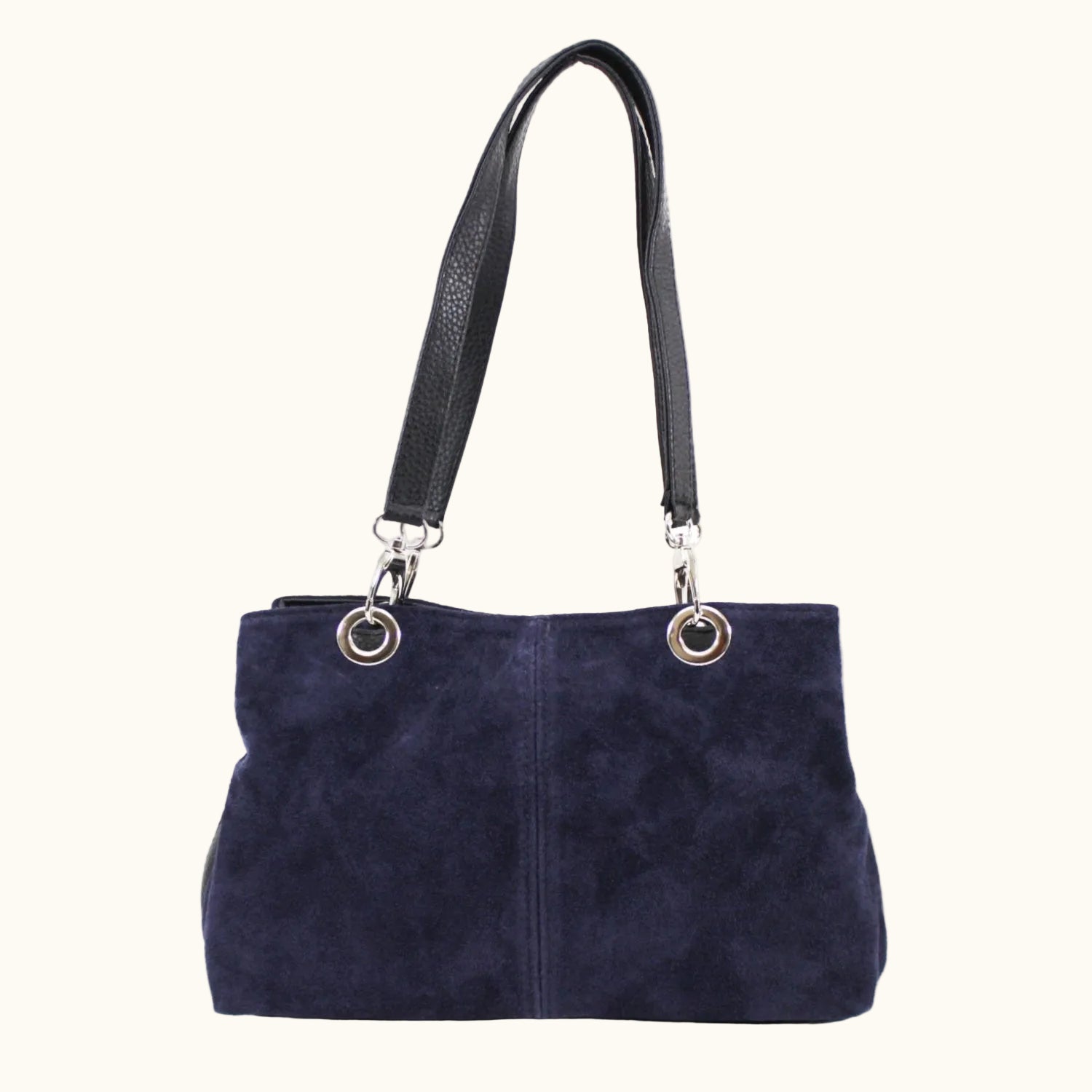 Navy blue handbag with black handle on a white background