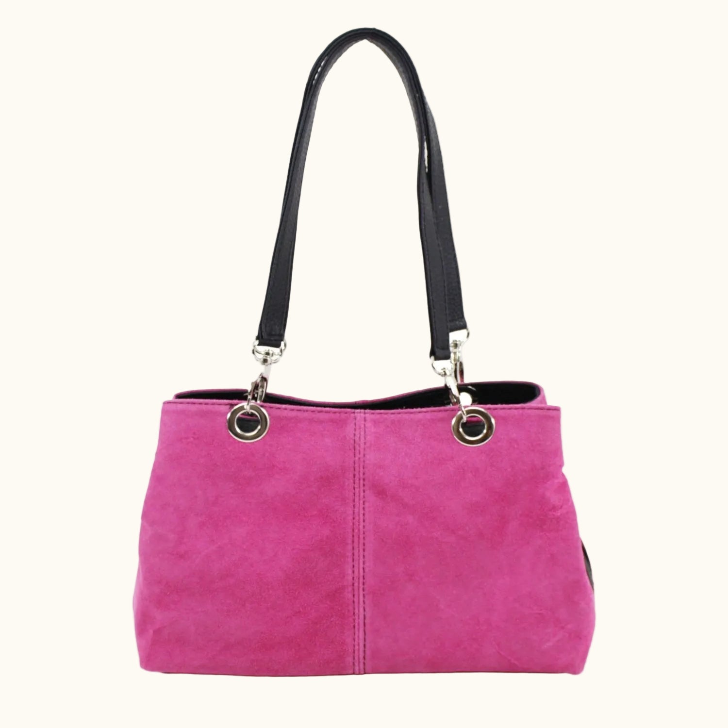 Pink handbag with black handle on a white background