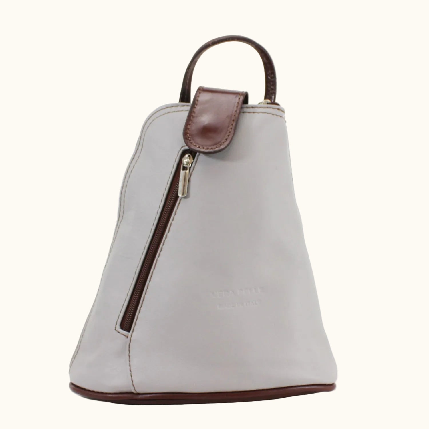 White handbag with brown accents on a white background