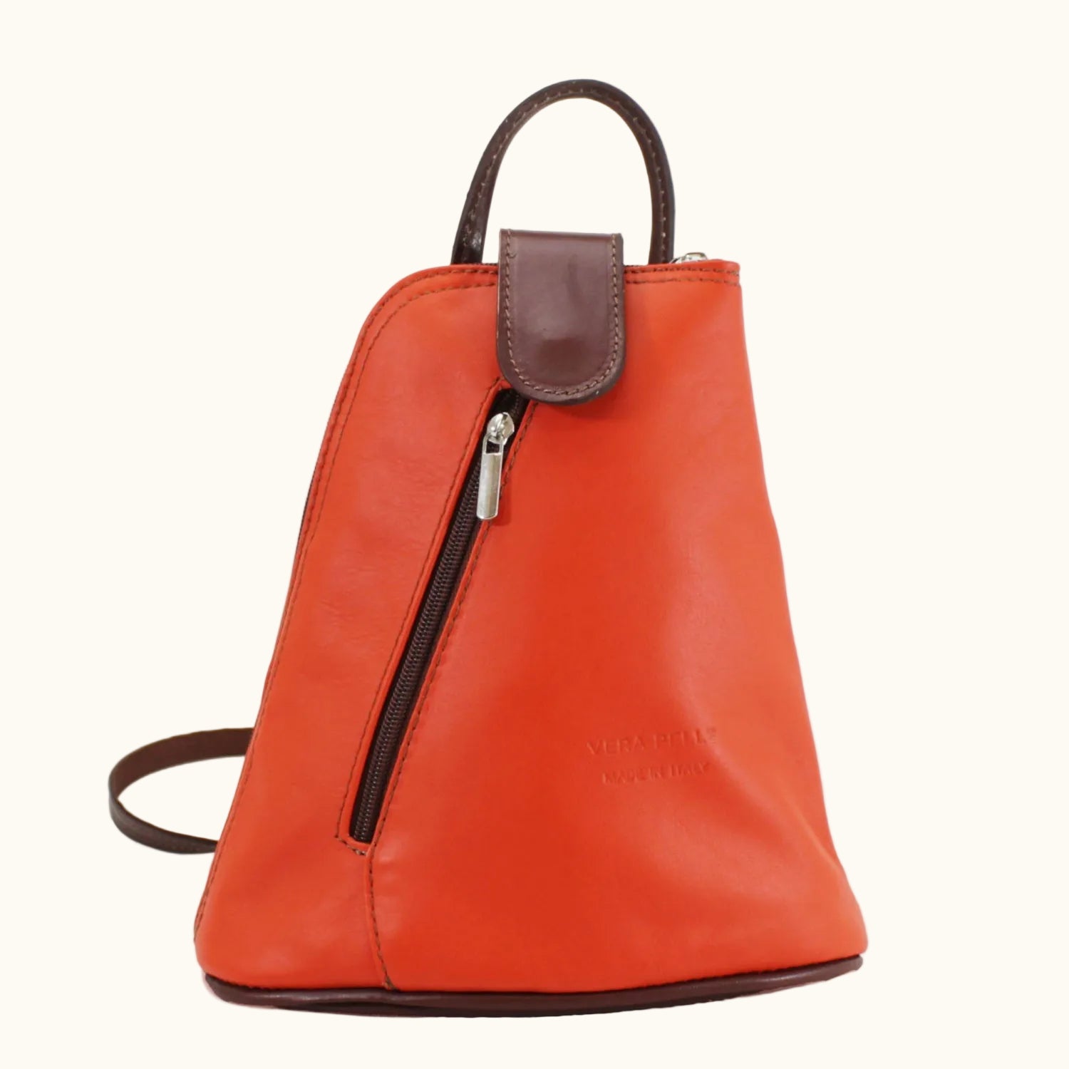 Orange leather backpack with brown accents on a white background