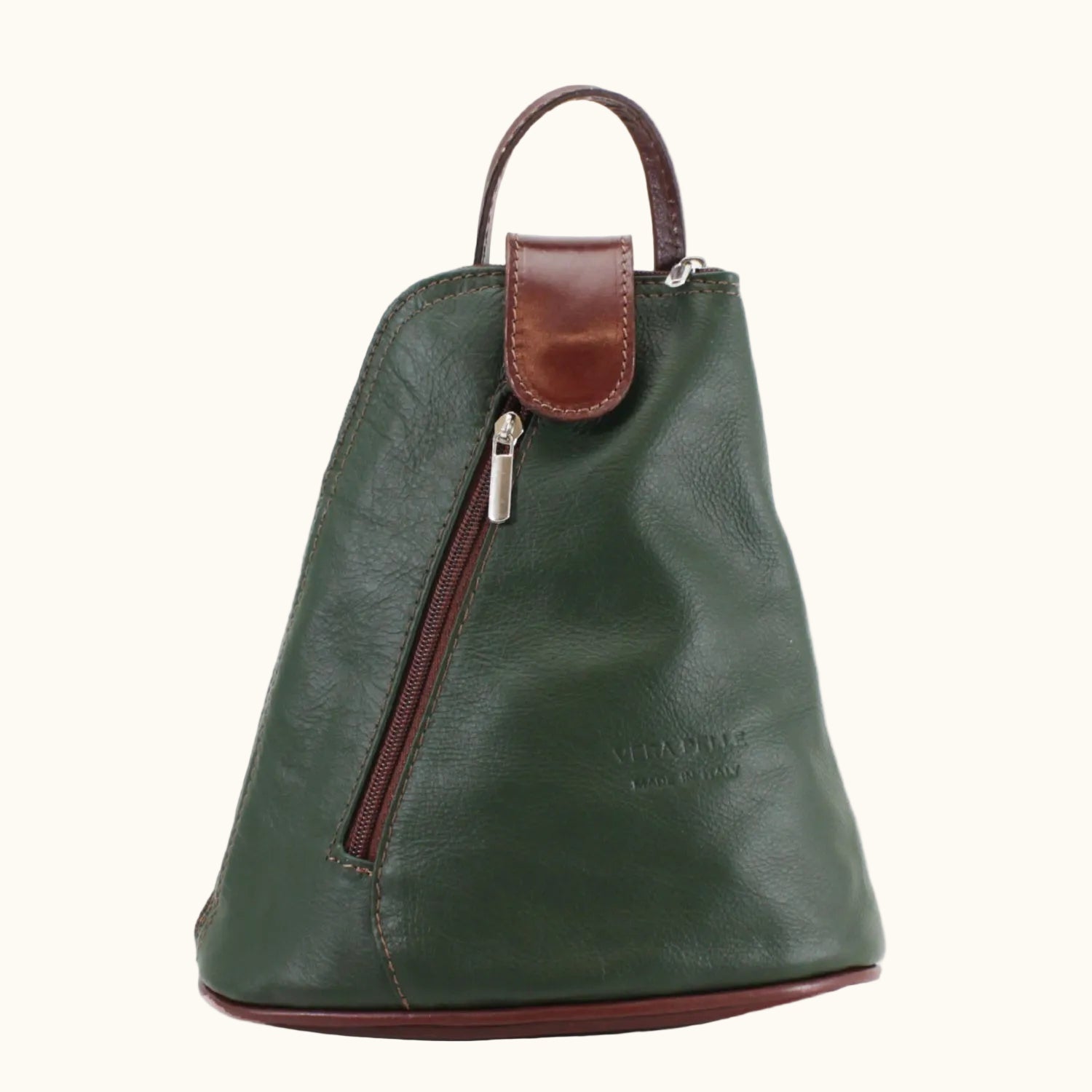 Green leather backpack with brown accents on a white background