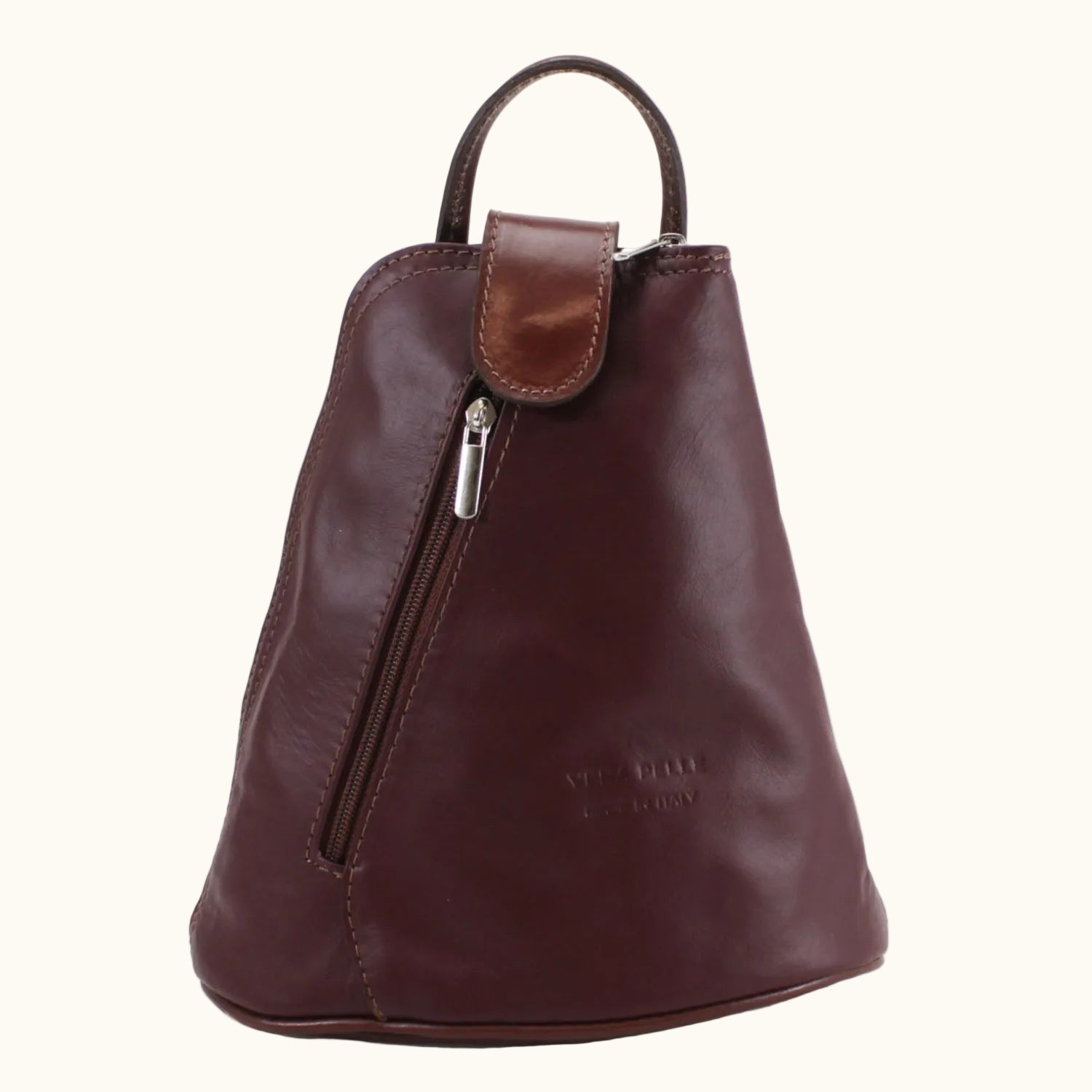 Brown leather backpack with a visible brand name on a white background