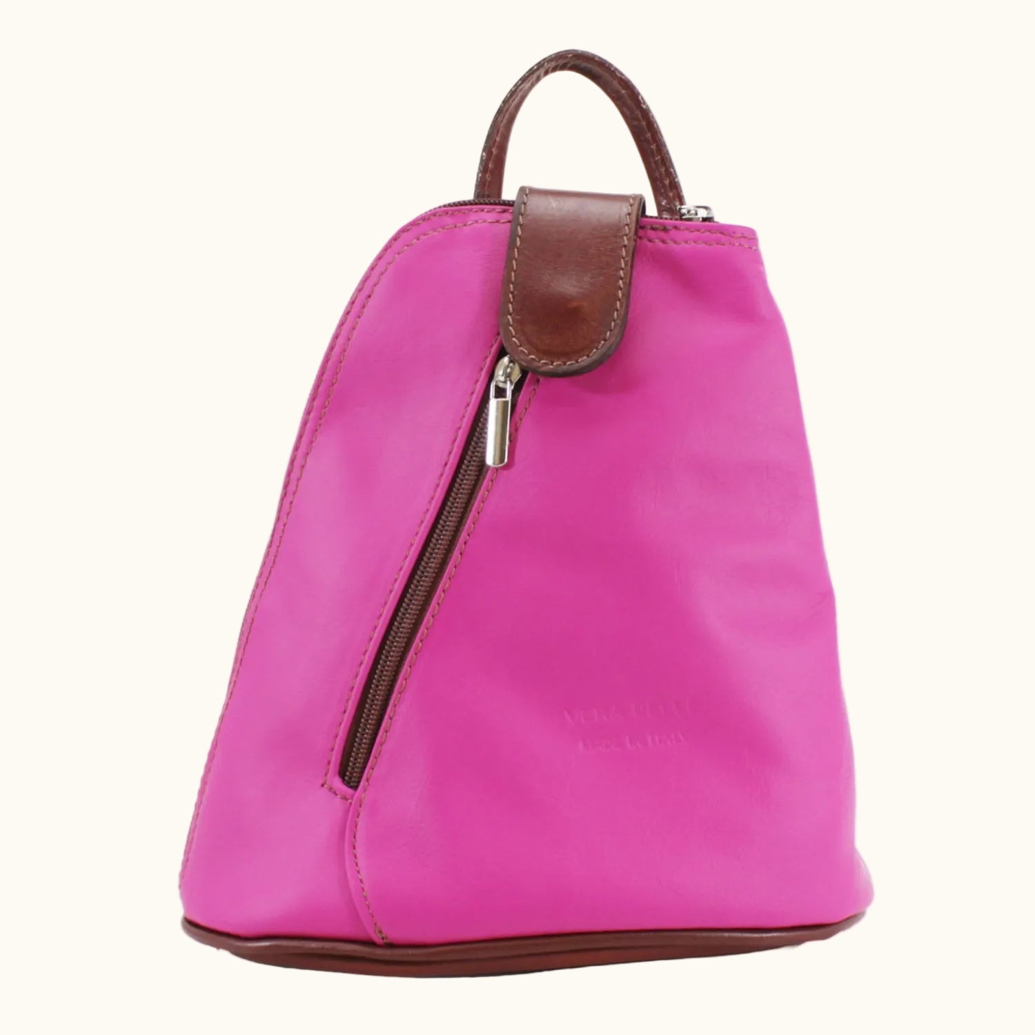 Pink backpack with brown accents on a white background