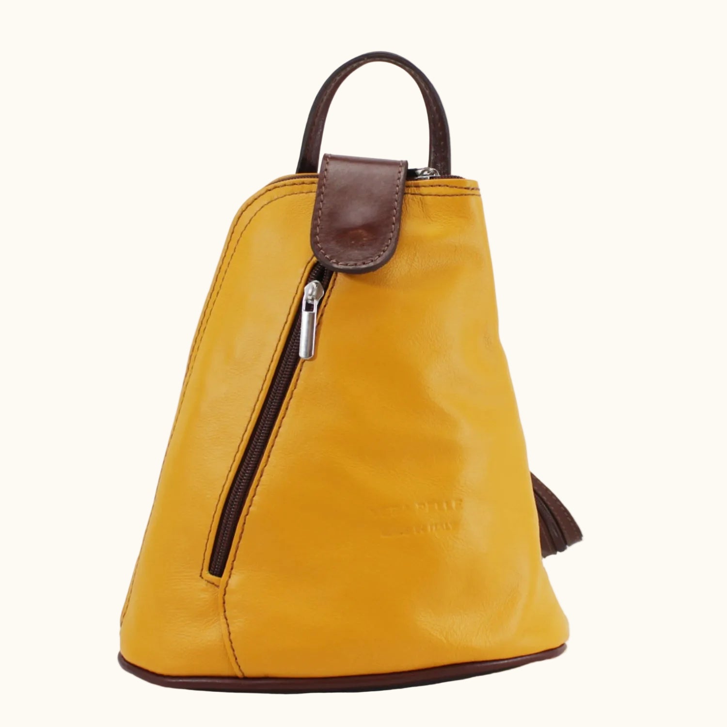 Yellow leather backpack with brown accents on a white background