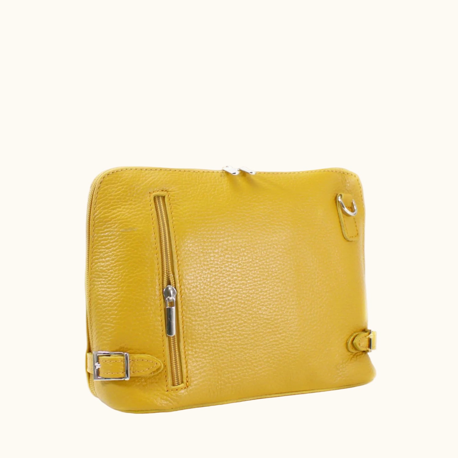 Yellow leather handbag with a zipper on a white background