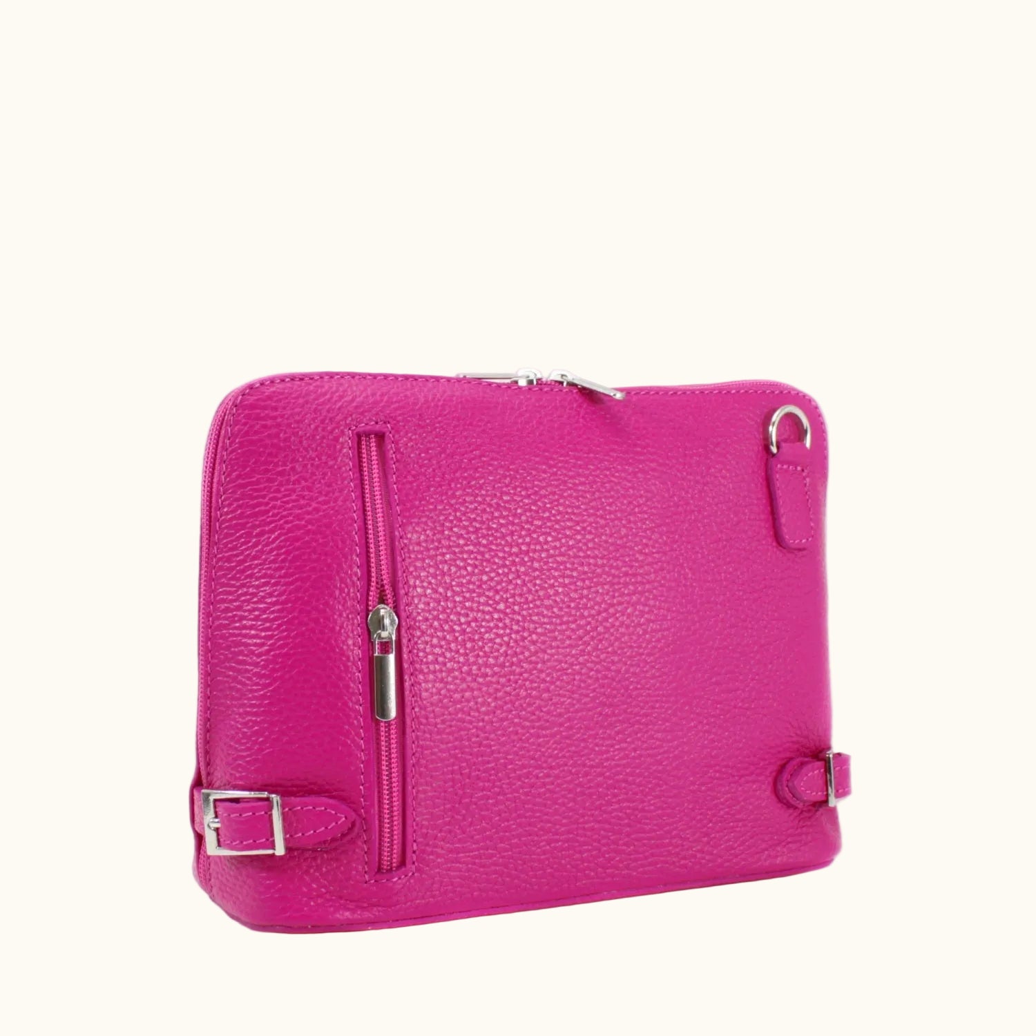 Pink leather bag with silver buckle on a white background