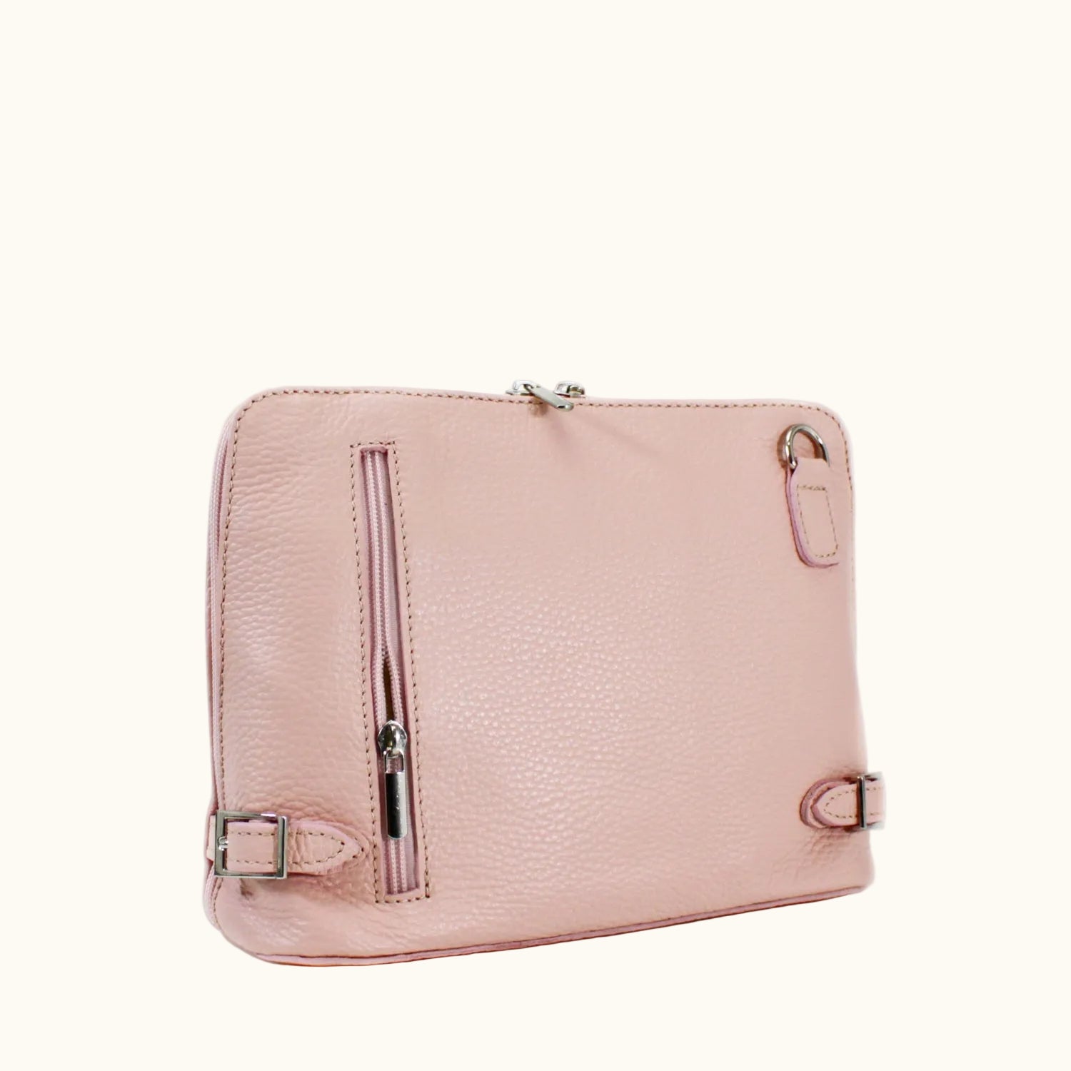 Pink leather bag with silver zippers on a white background