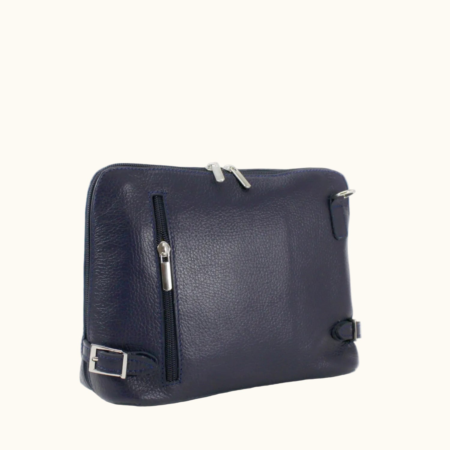 Navy blue leather bag with silver zippers on a white background