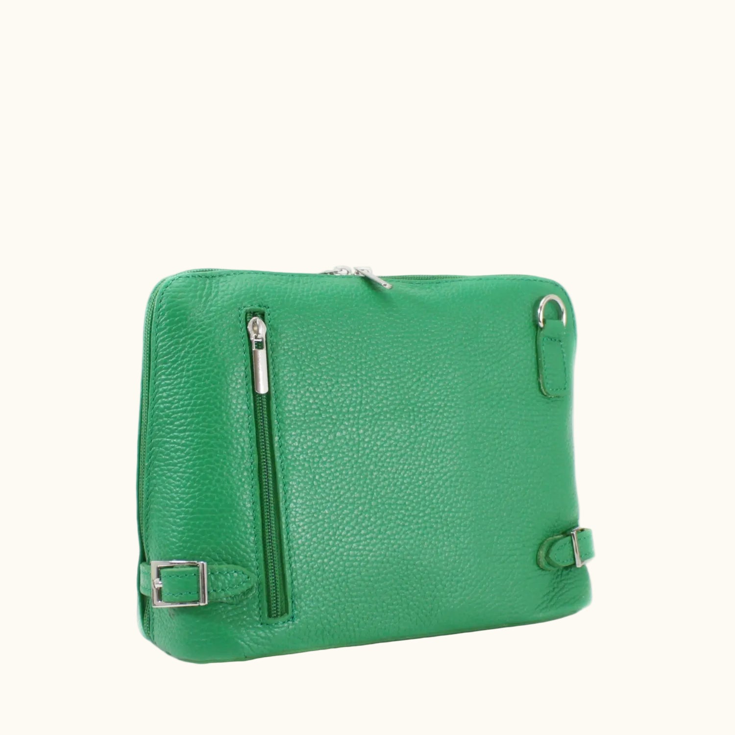 Green leather bag with silver zippers and buckles on a white background