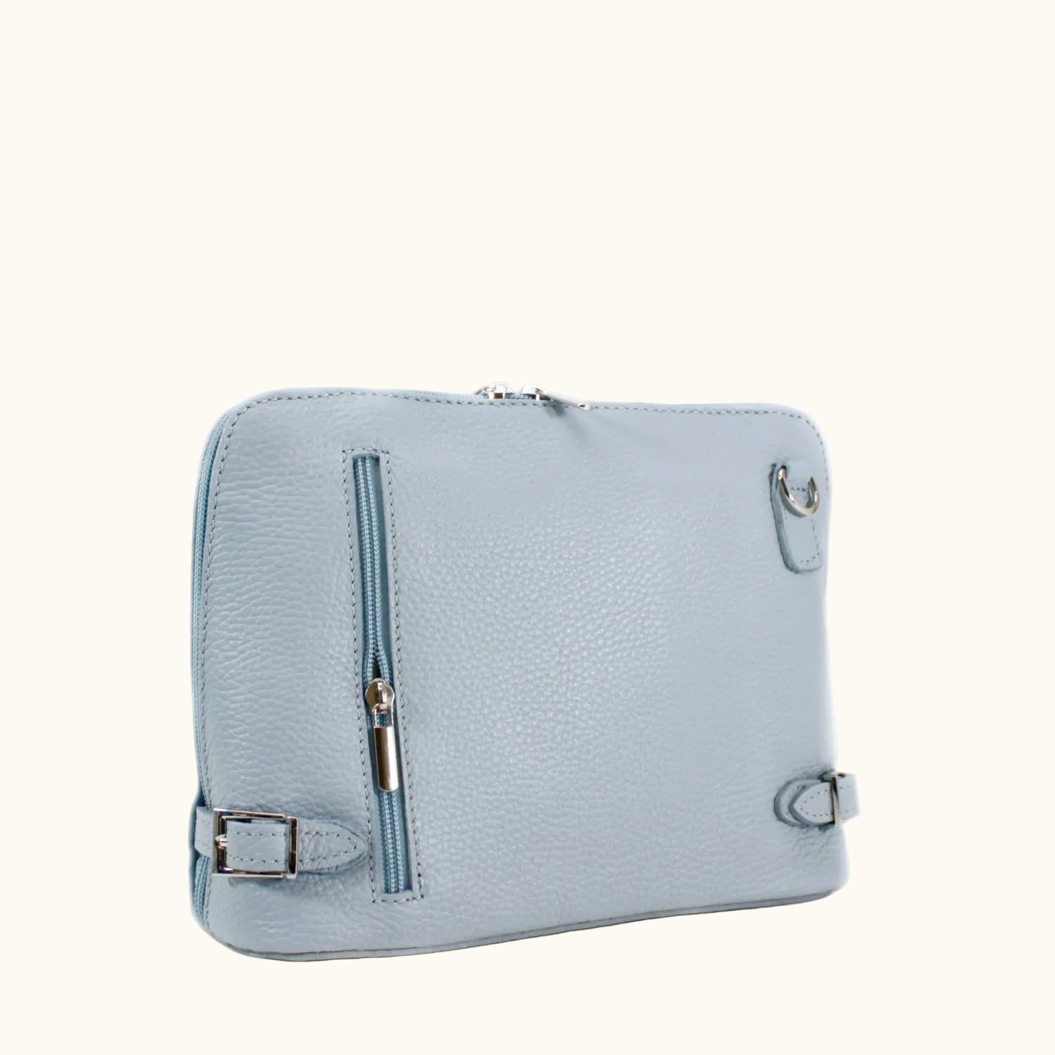 Light blue leather bag with silver buckles on a white background