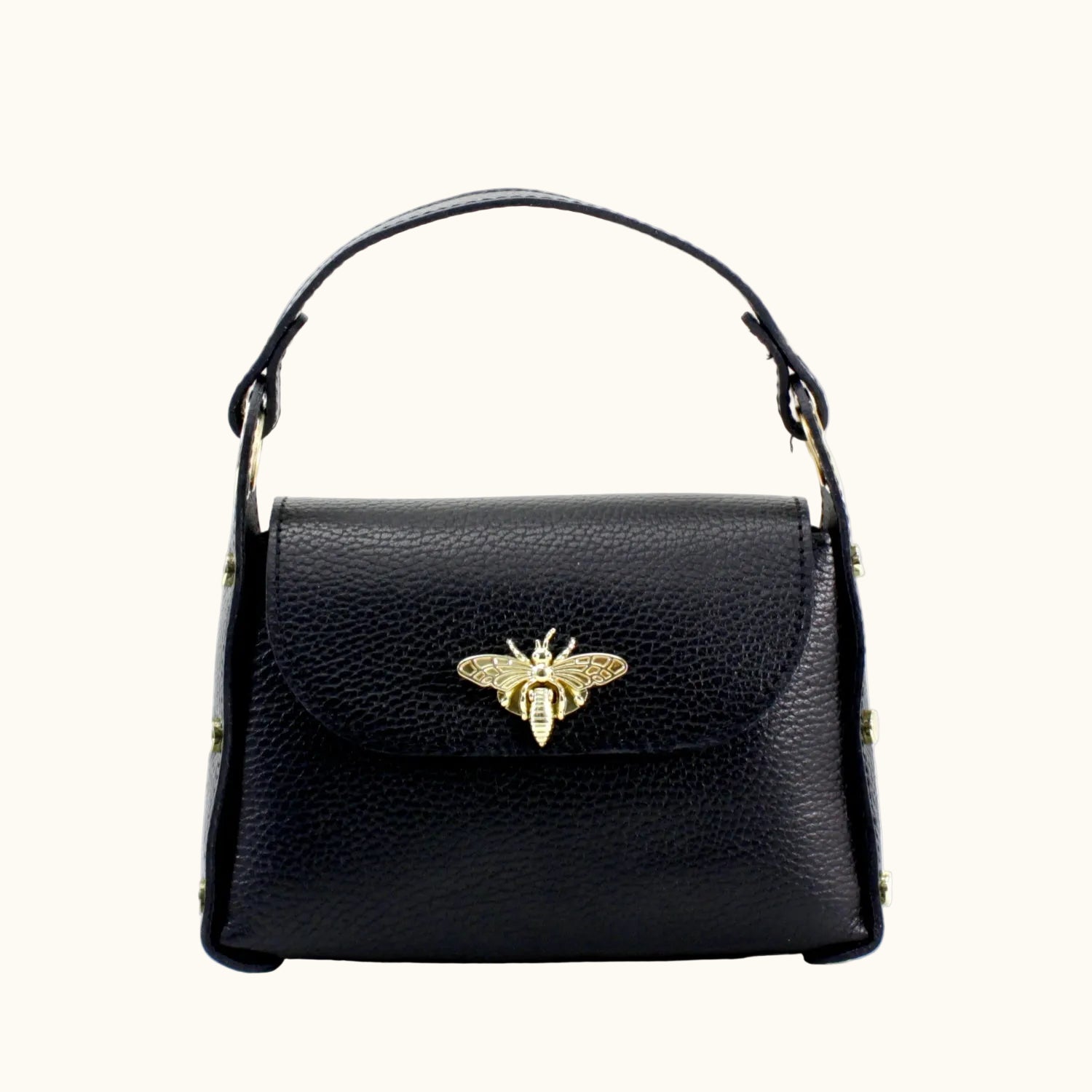 Black handbag with a gold bee emblem on a white background
