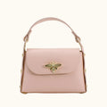 Pink handbag with a gold bee emblem on a white background