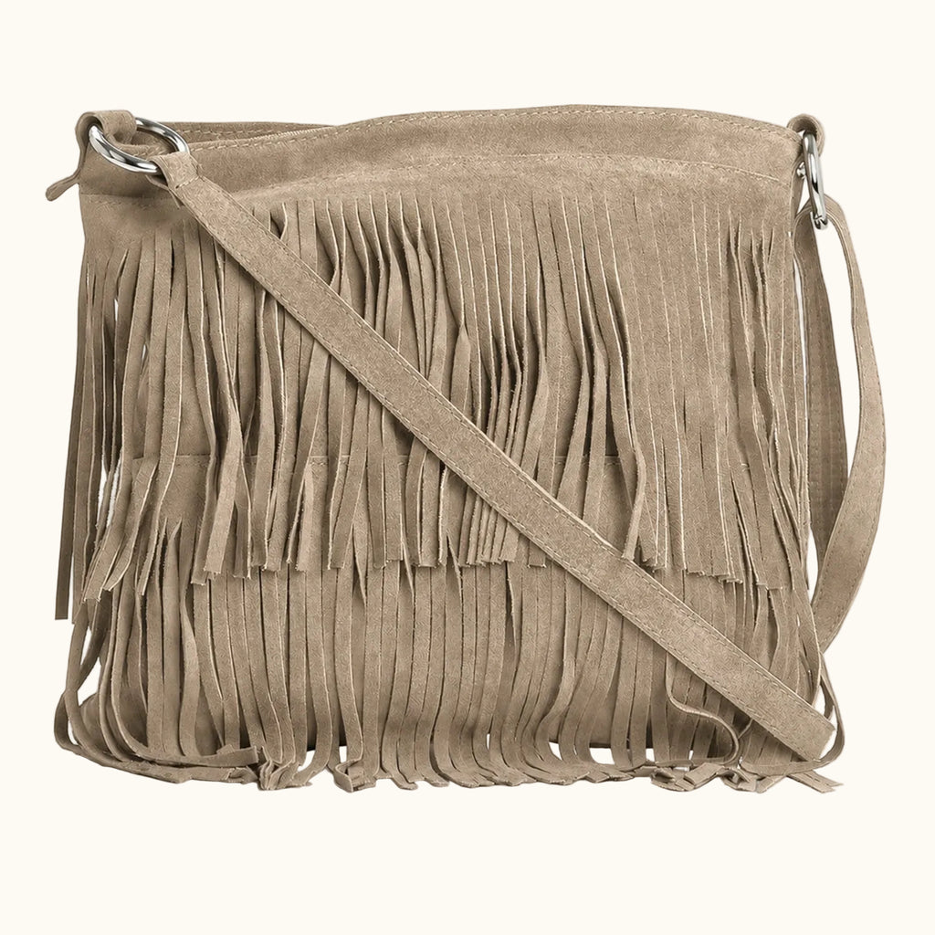 Beige suede handbag with fringe details on a white background