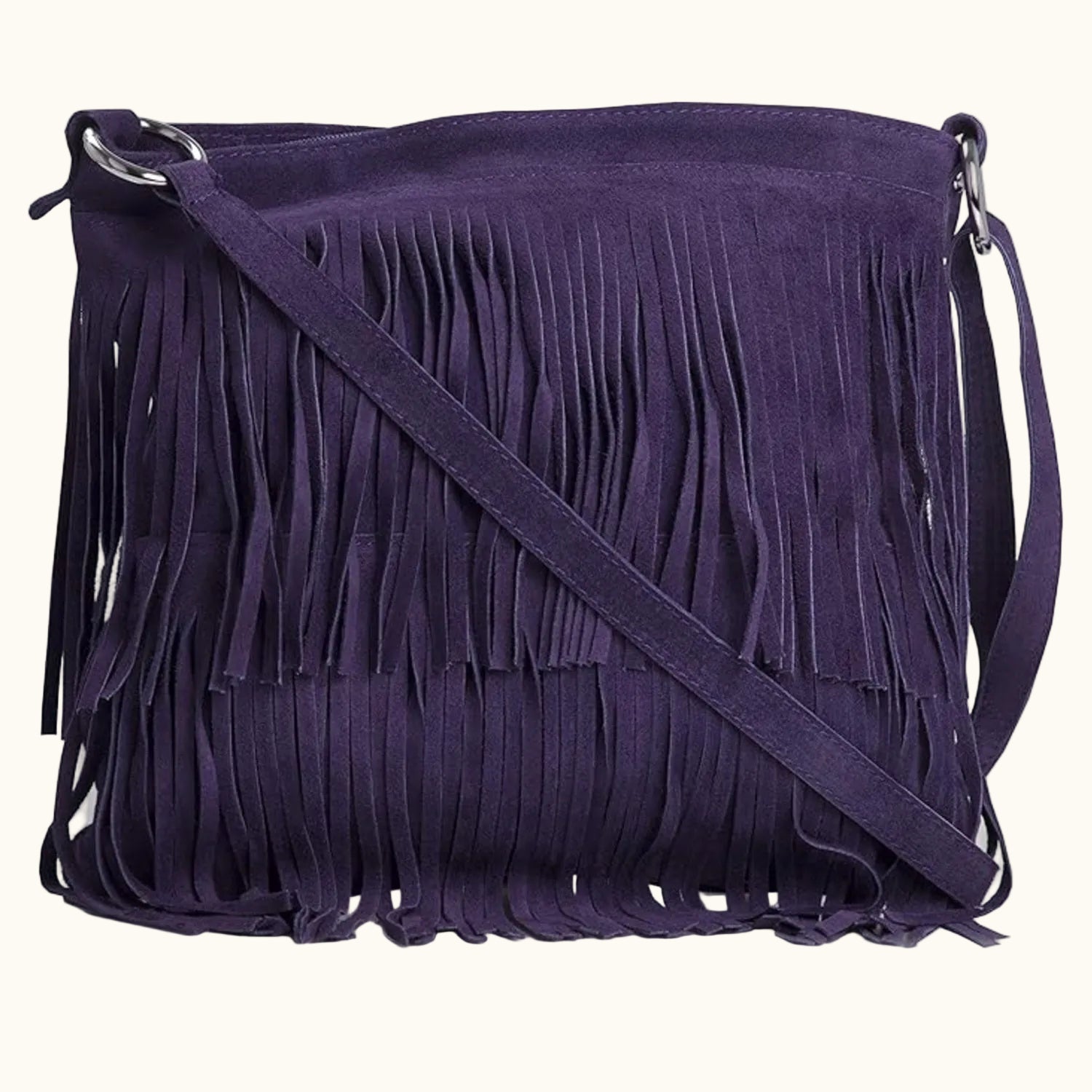 Purple suede handbag with fringe details on a white background