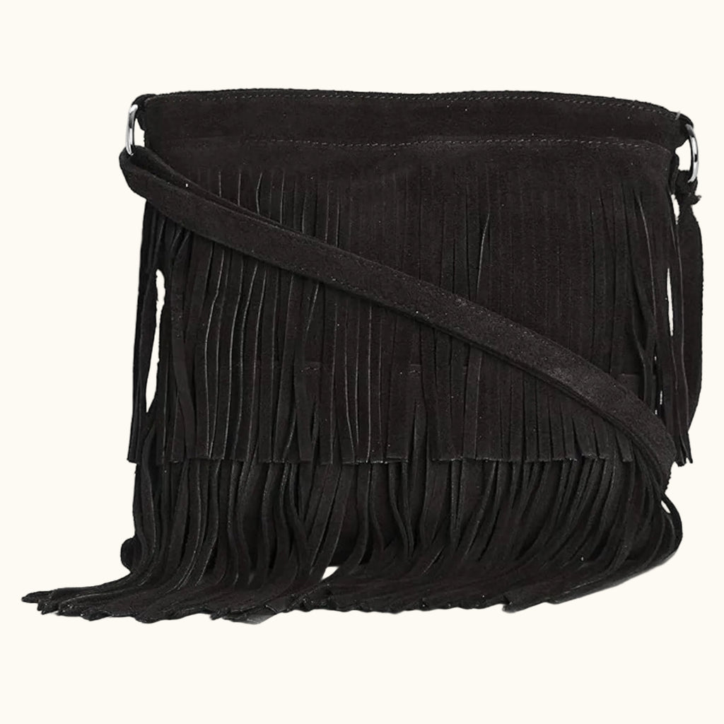 Black suede handbag with fringe details on a white background