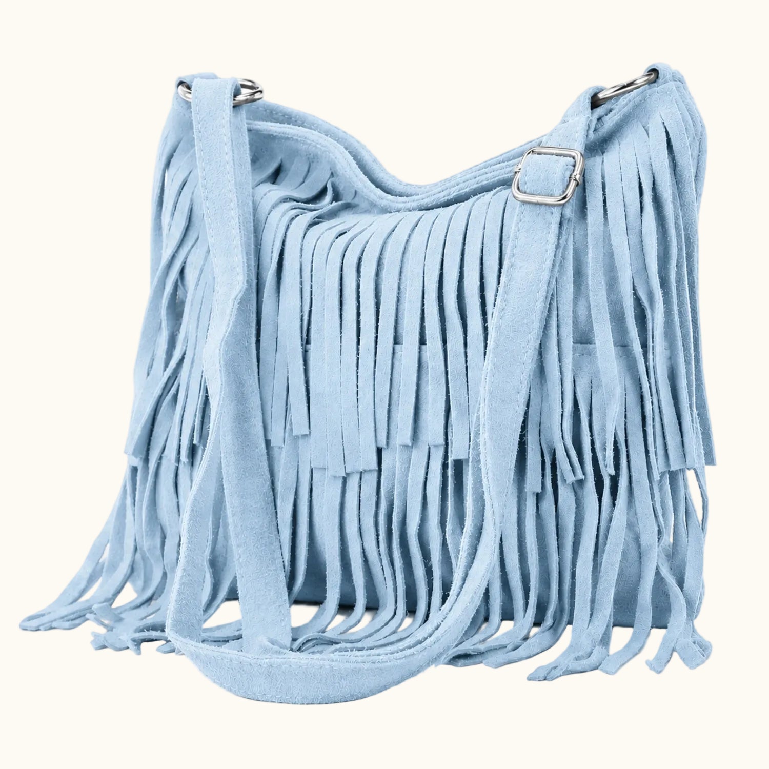 Light blue suede handbag with fringe details on a white background