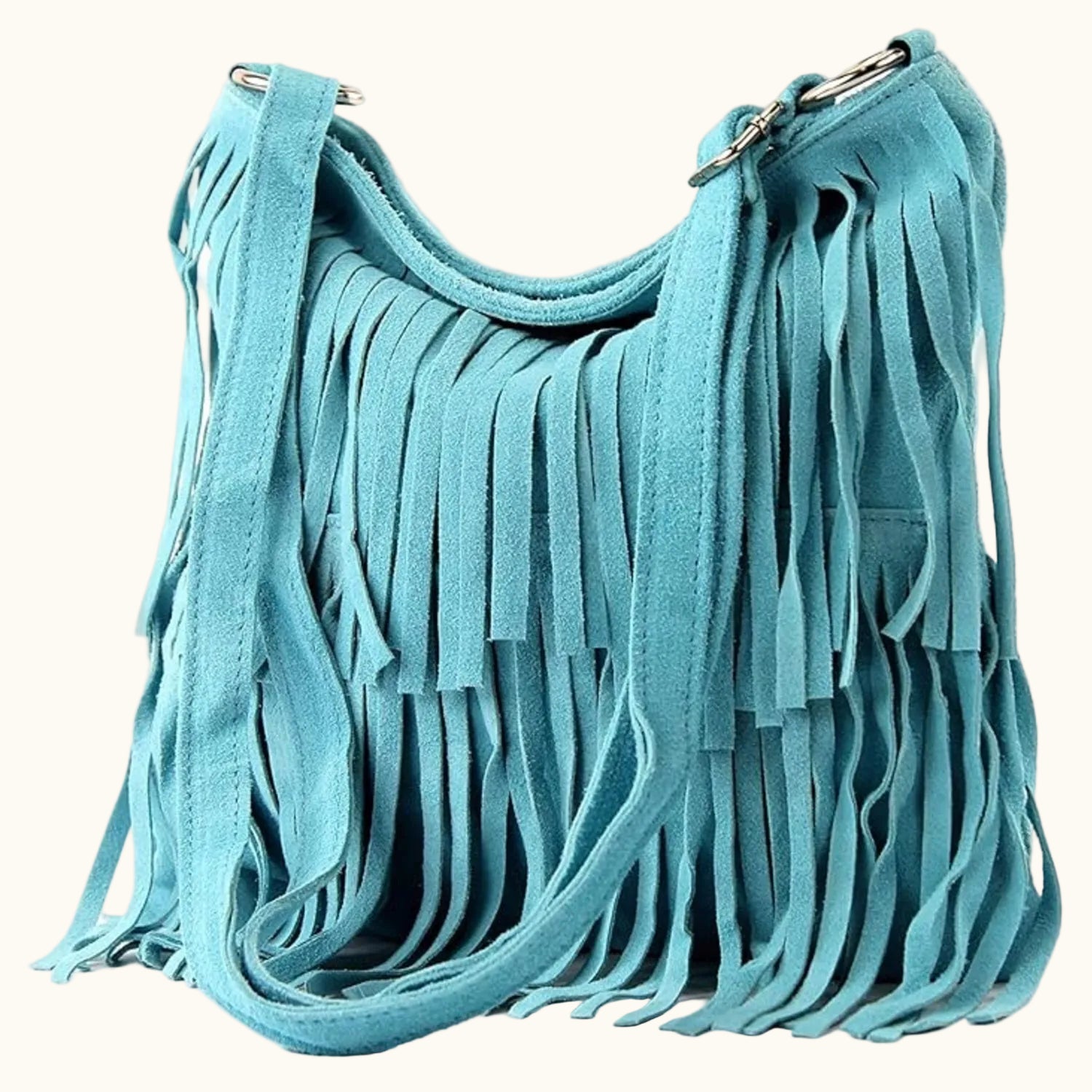 Turquoise handbag with fringe details on a white background
