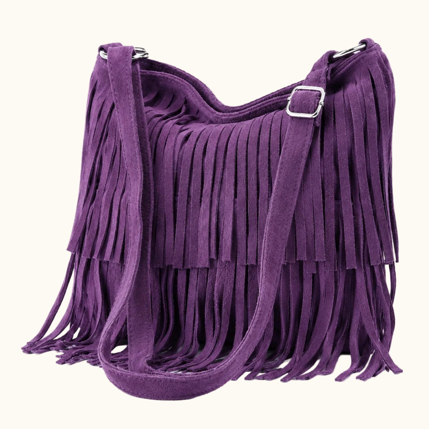 Purple fringe handbag on a white background