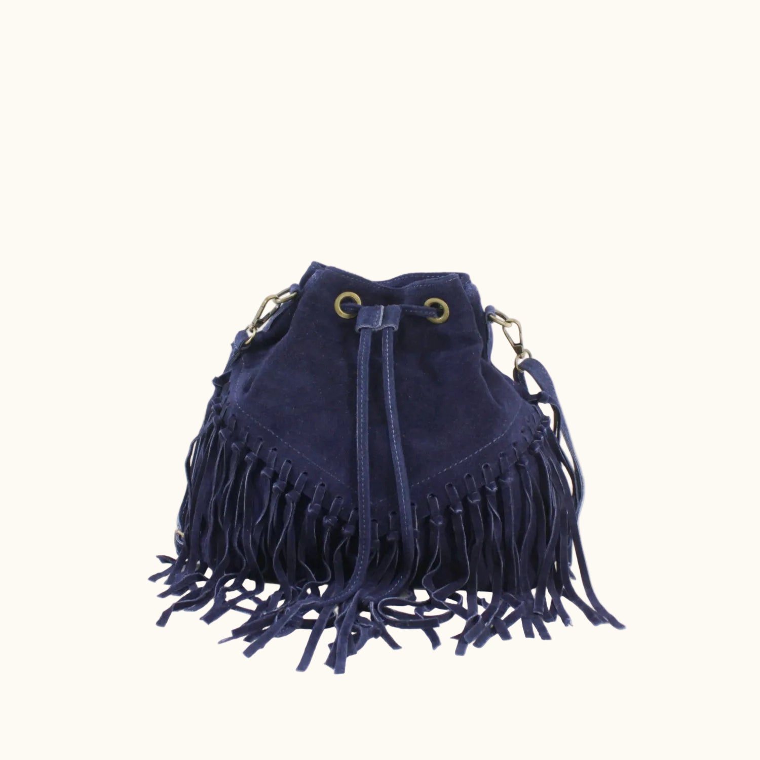 Navy blue suede bag with fringe details on a white background