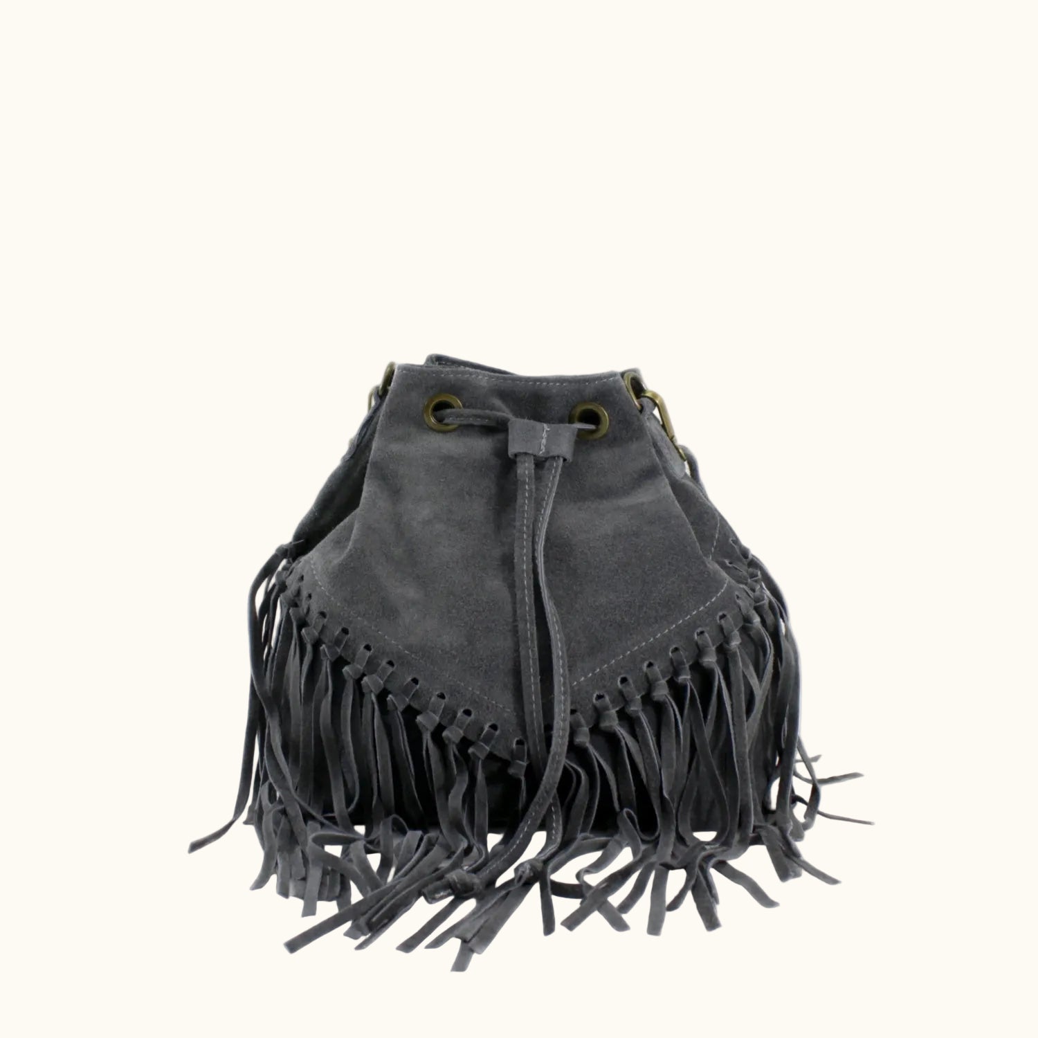 Gray suede handbag with fringe details on a white background