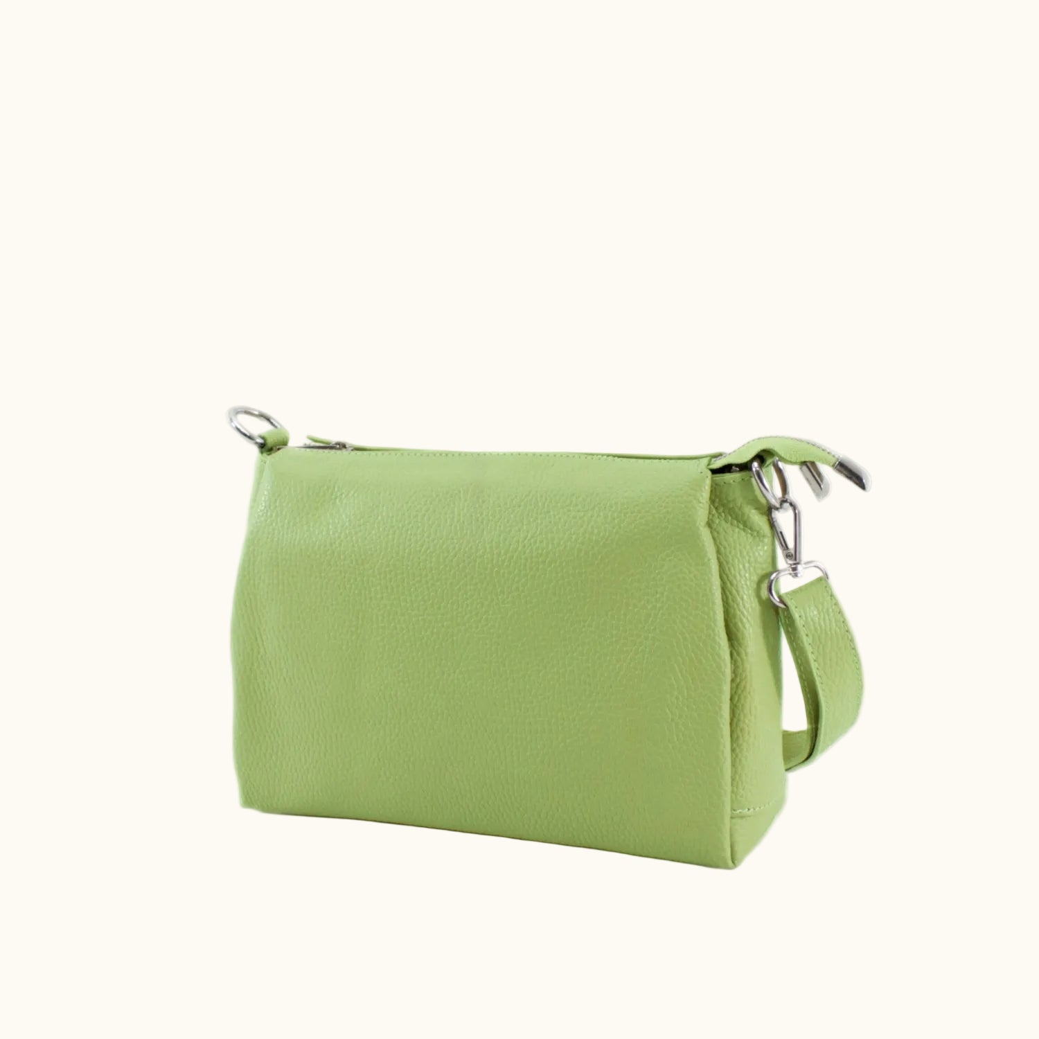 Green handbag with a strap on a white background