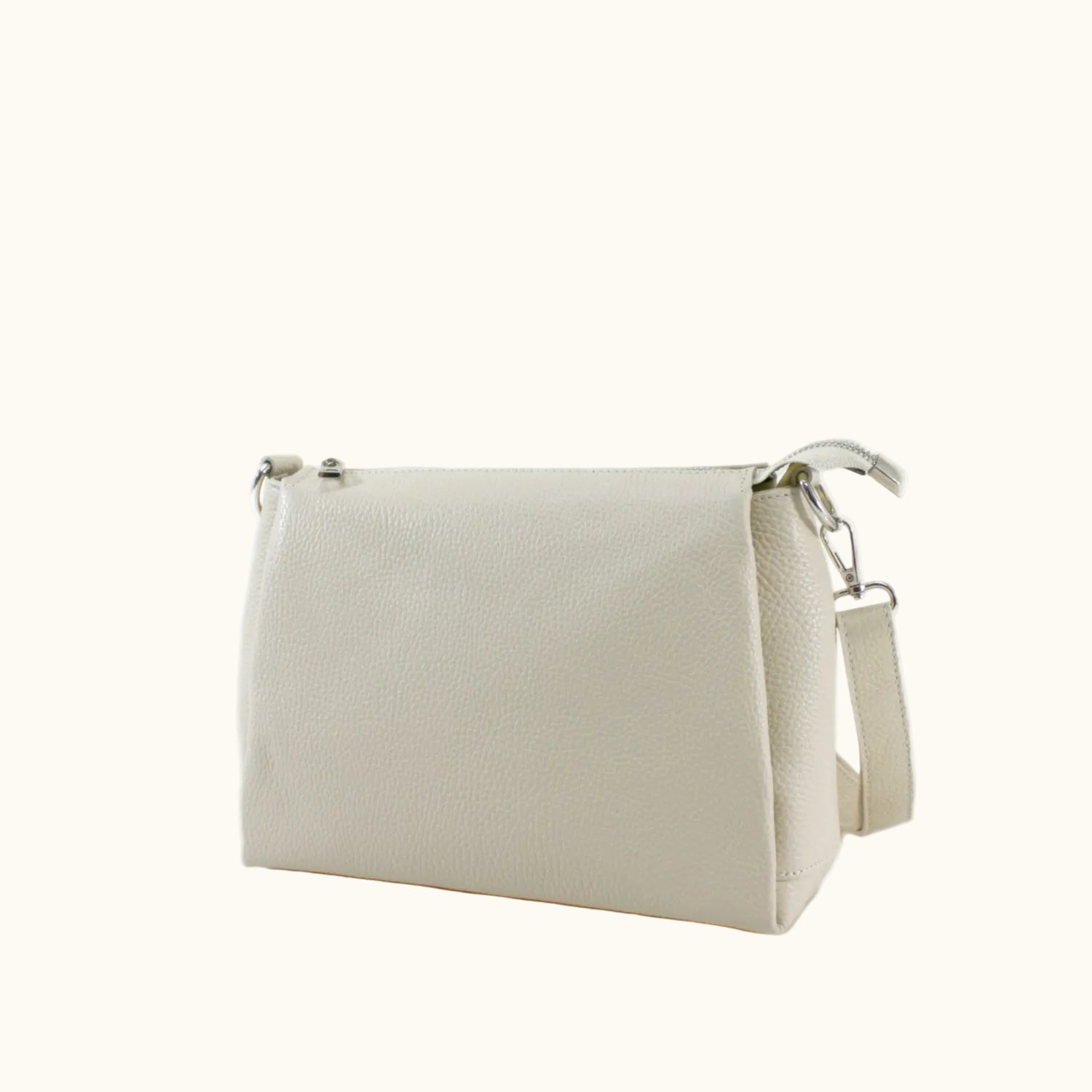 Beige handbag with a strap on a white background