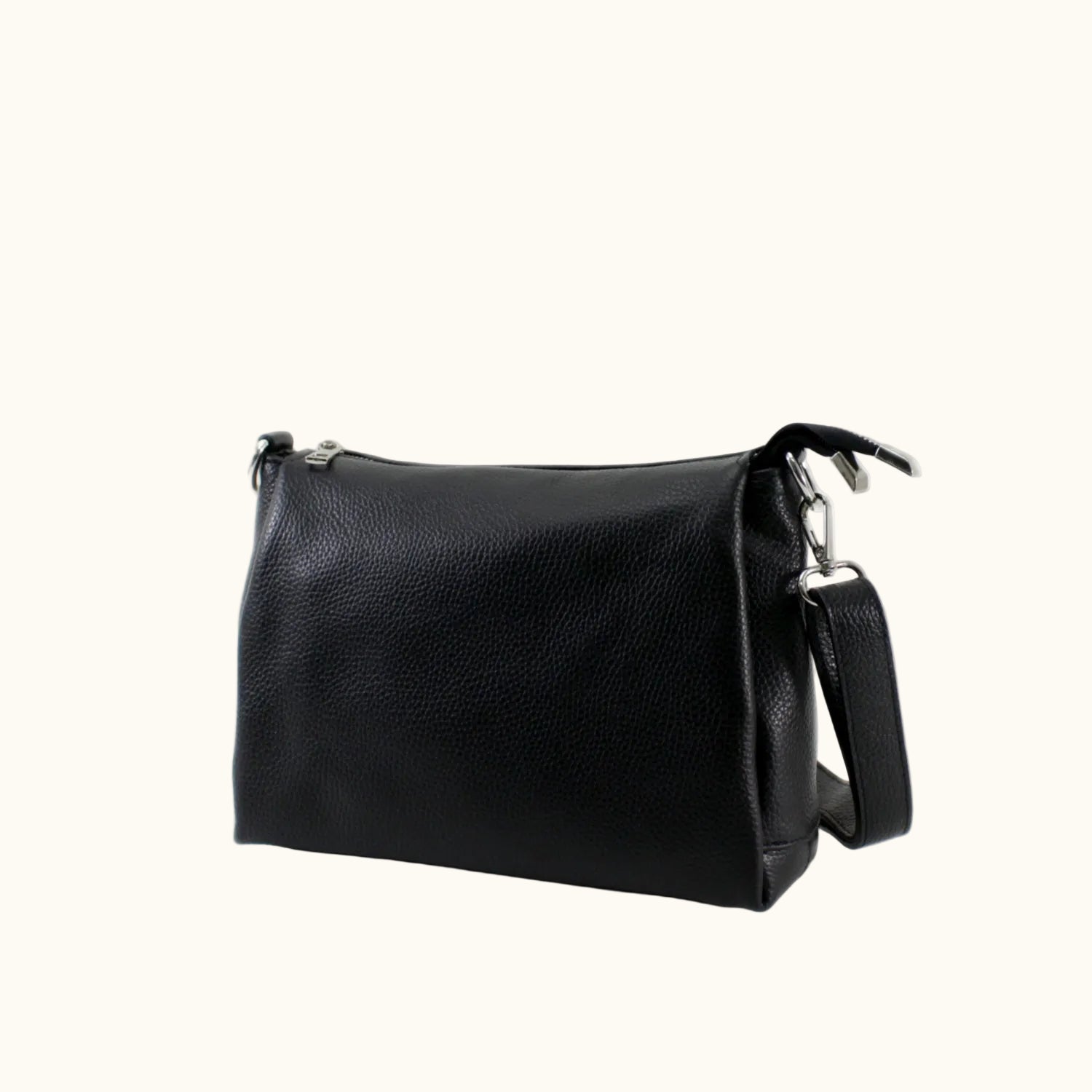 Black leather handbag with a shoulder strap on a white background