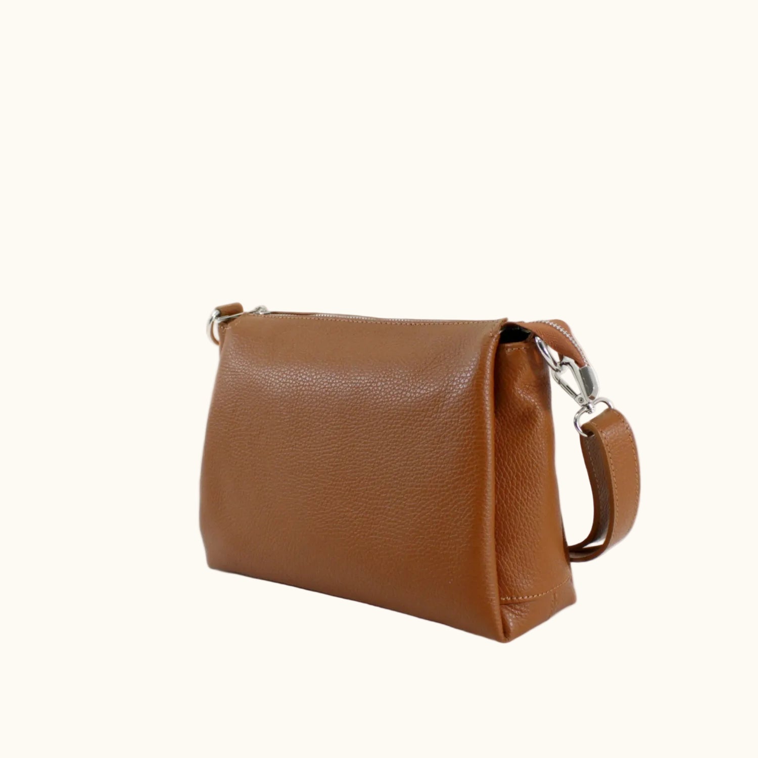 Brown leather handbag on a white background