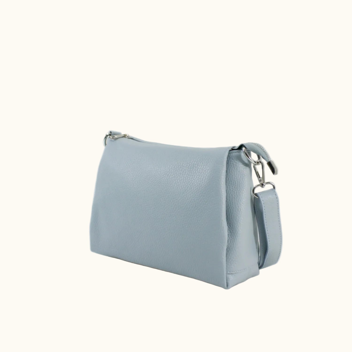 Light blue handbag with a strap on a white background