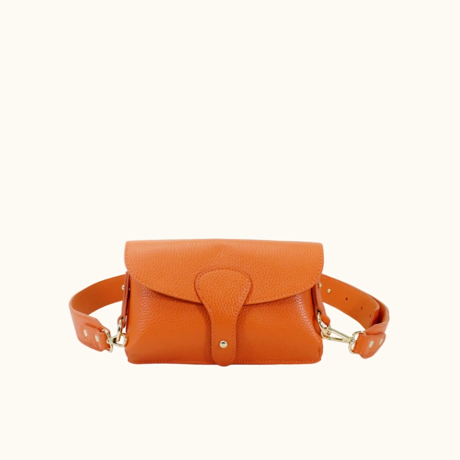 Orange leather bag with a strap on a white background