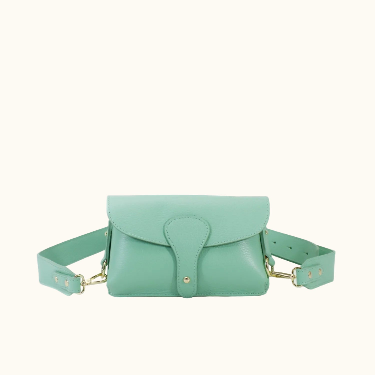 Mint green handbag with a strap on a white background