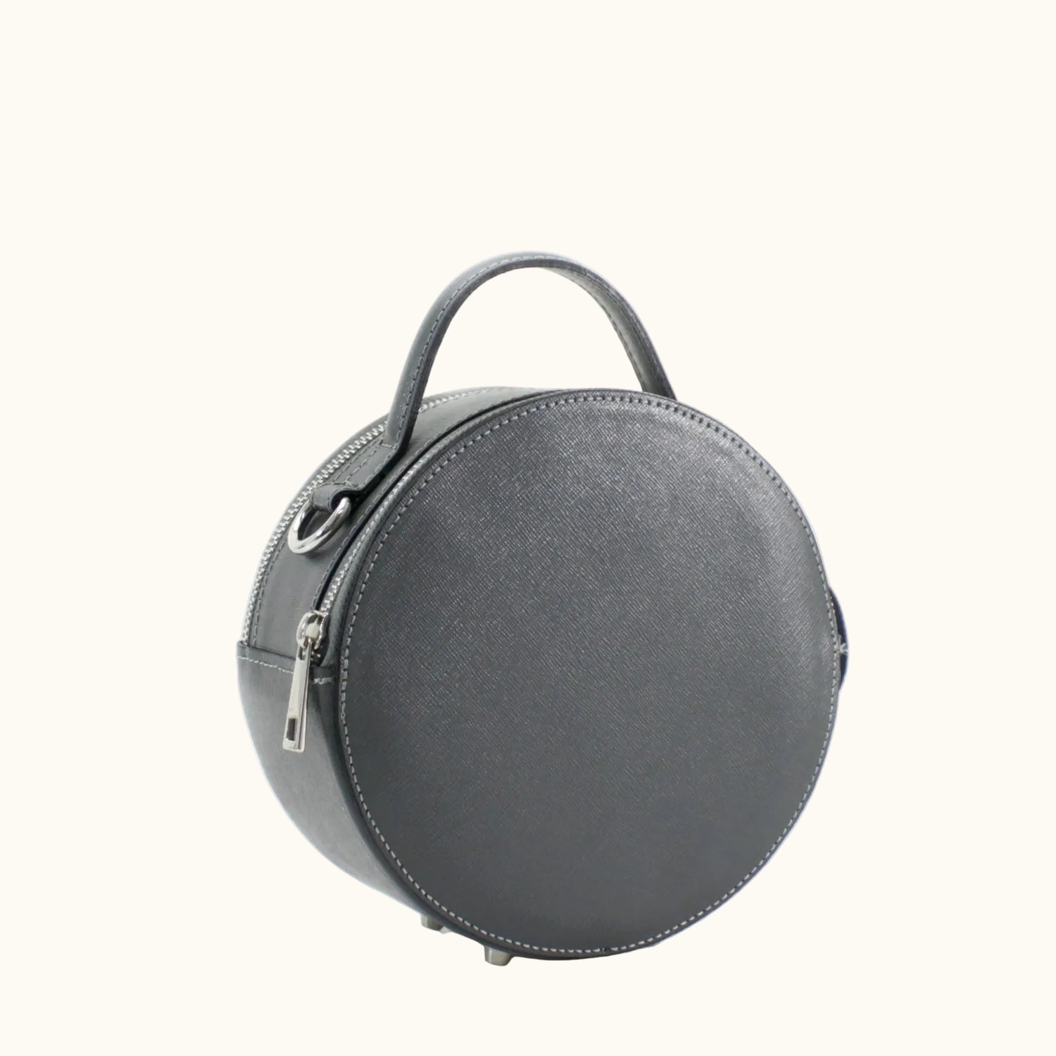 Round gray handbag with a handle on a white background