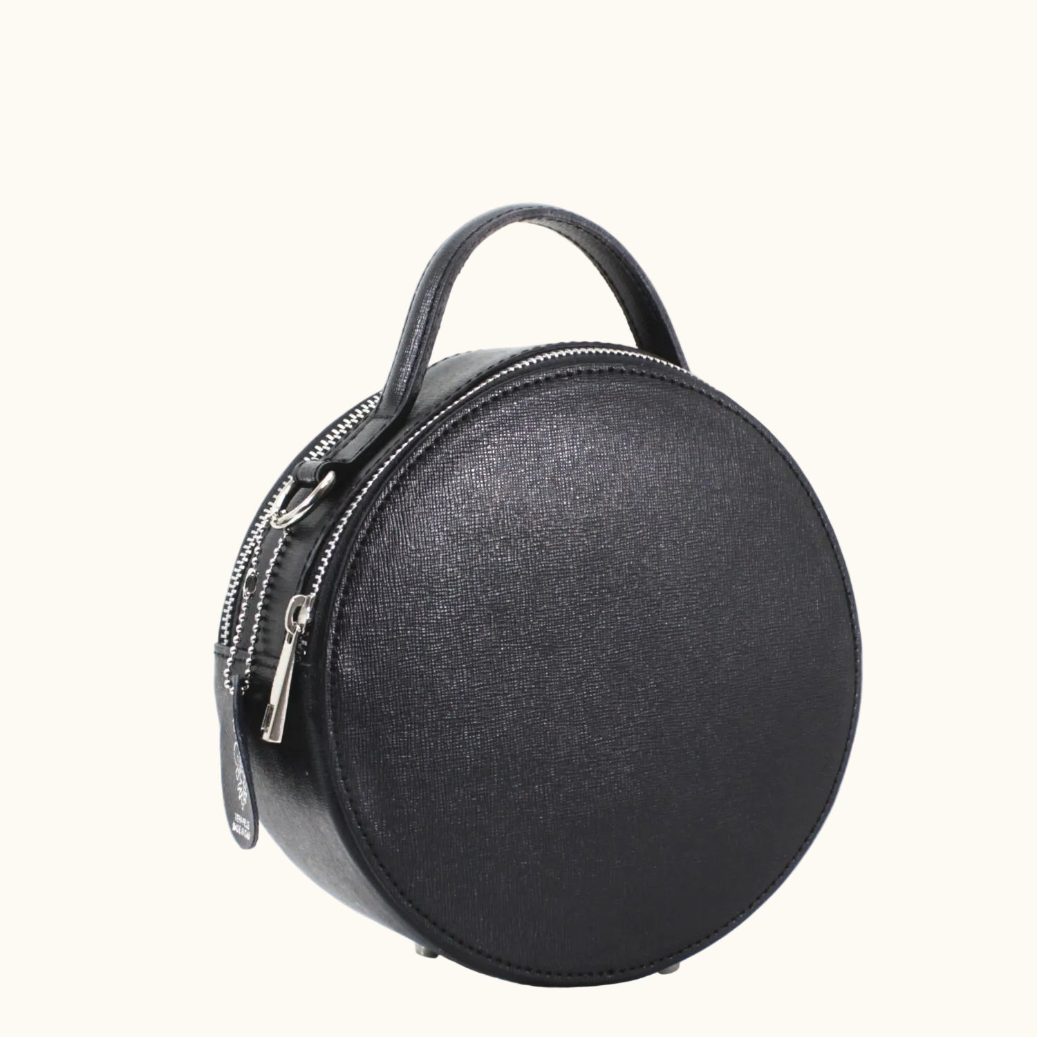 Black round handbag with a zipper on a white background
