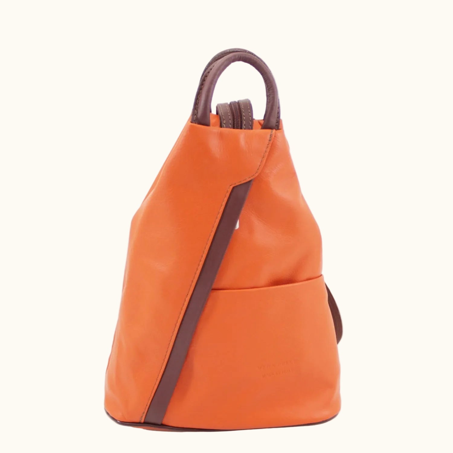 Orange backpack with brown straps on a white background