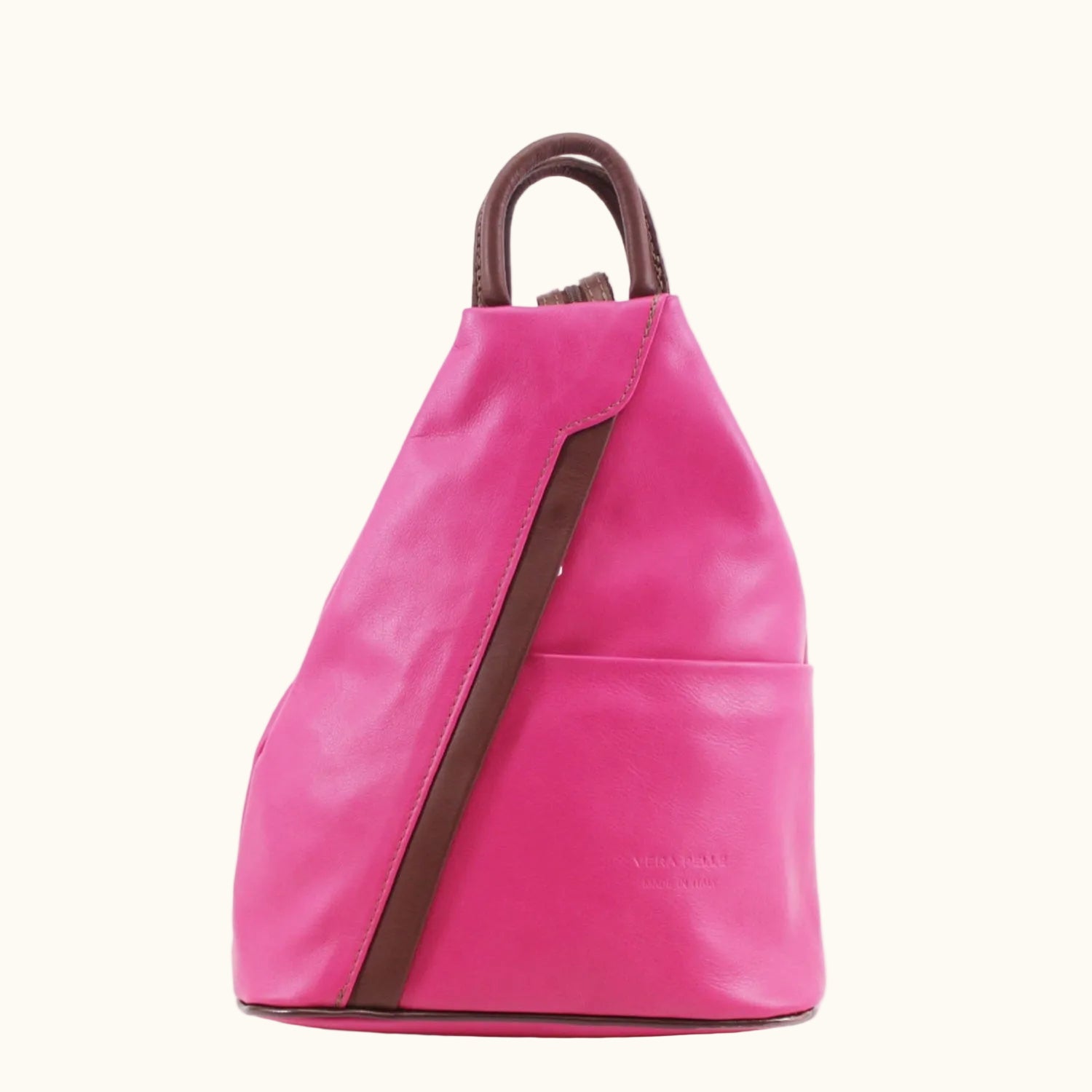 Pink backpack with brown straps on a white background