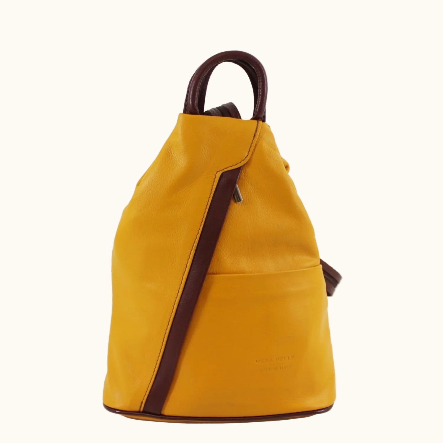 Yellow backpack with brown straps on a white background