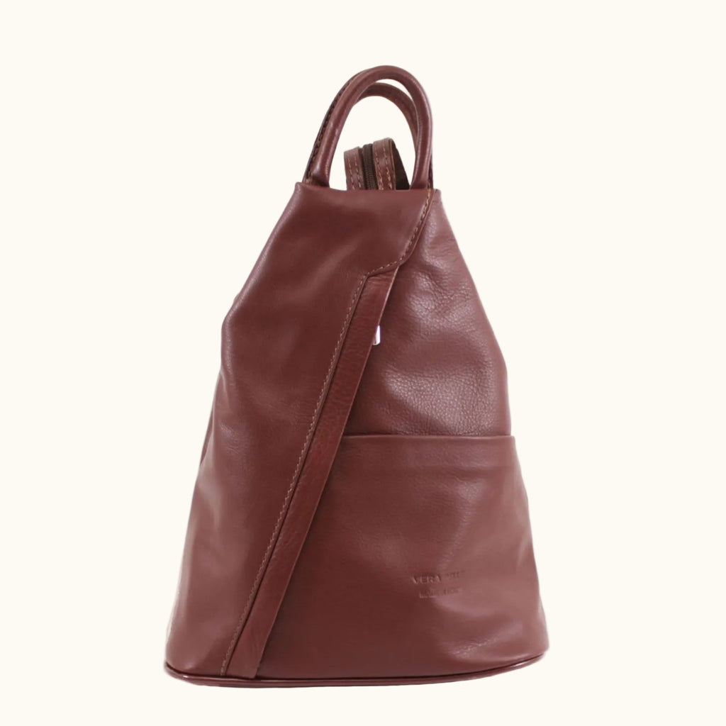 Brown leather backpack on a white background