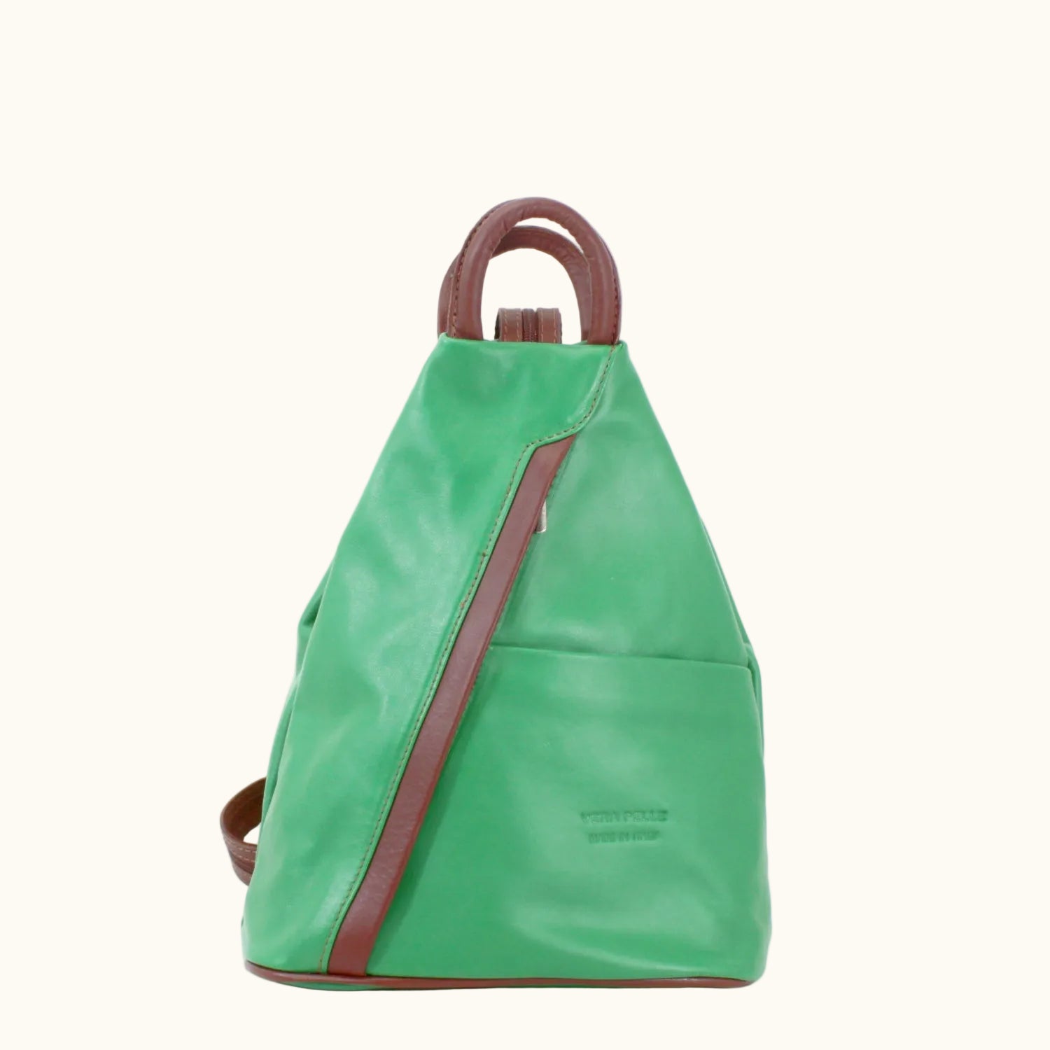 Green backpack with brown straps and handle on a white background