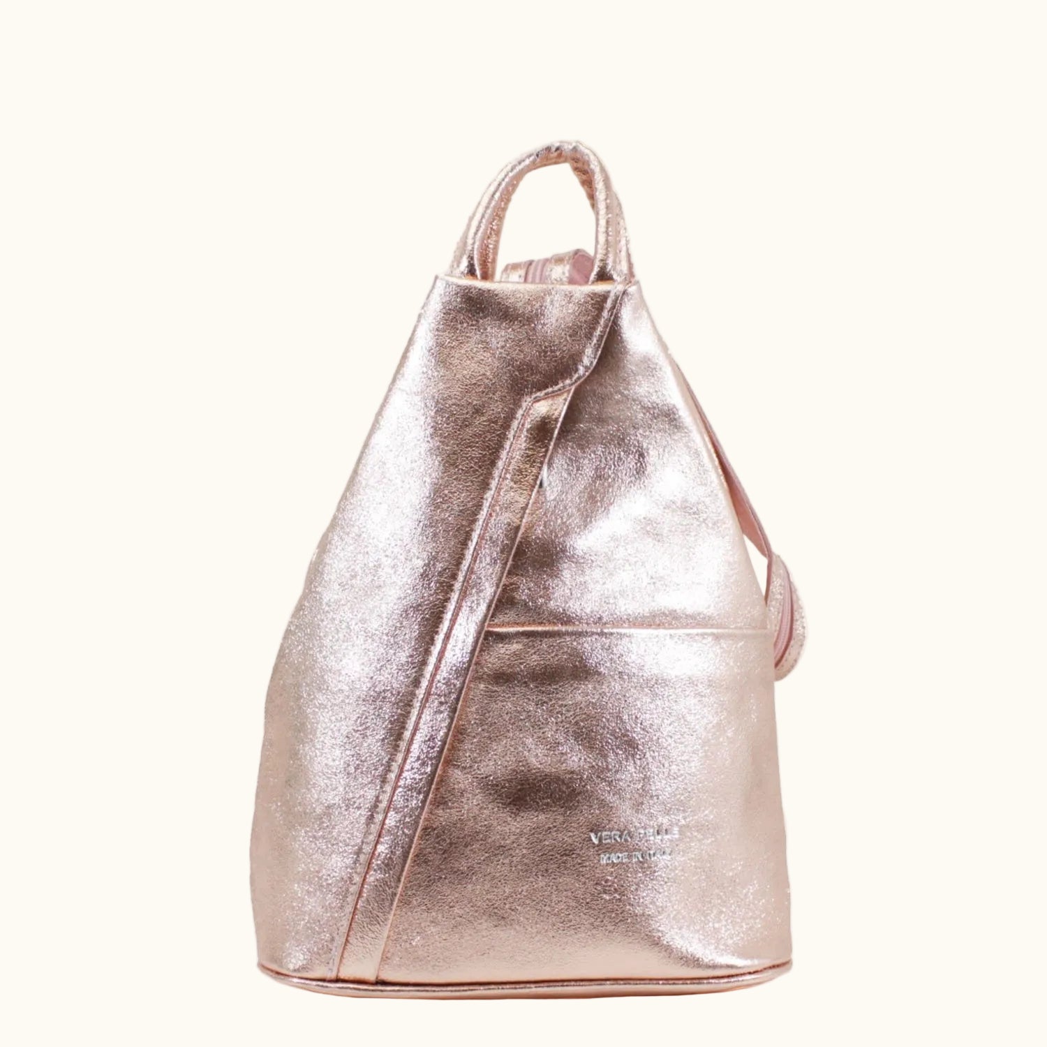 Rose gold backpack on a white background