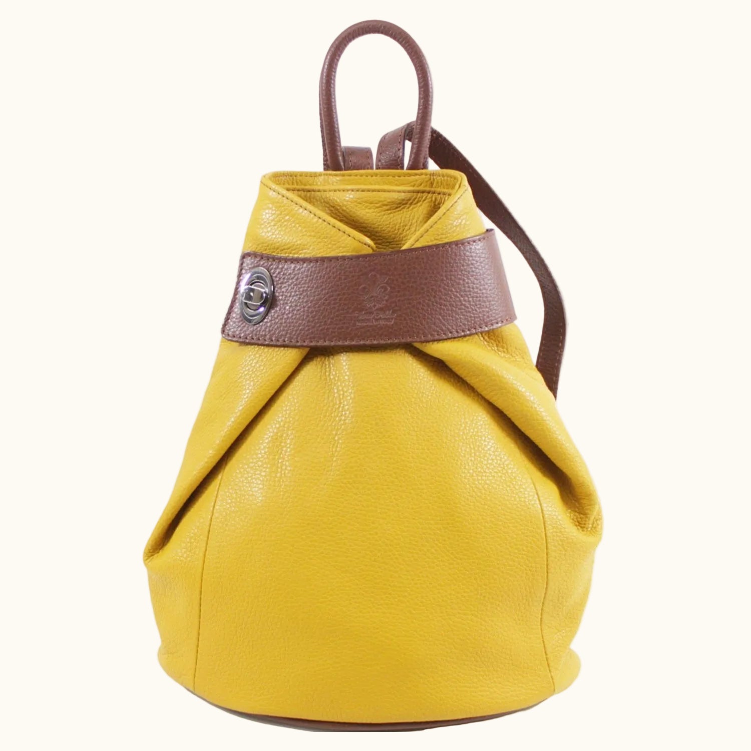 Yellow drawstring bag with brown leather strap on a white background