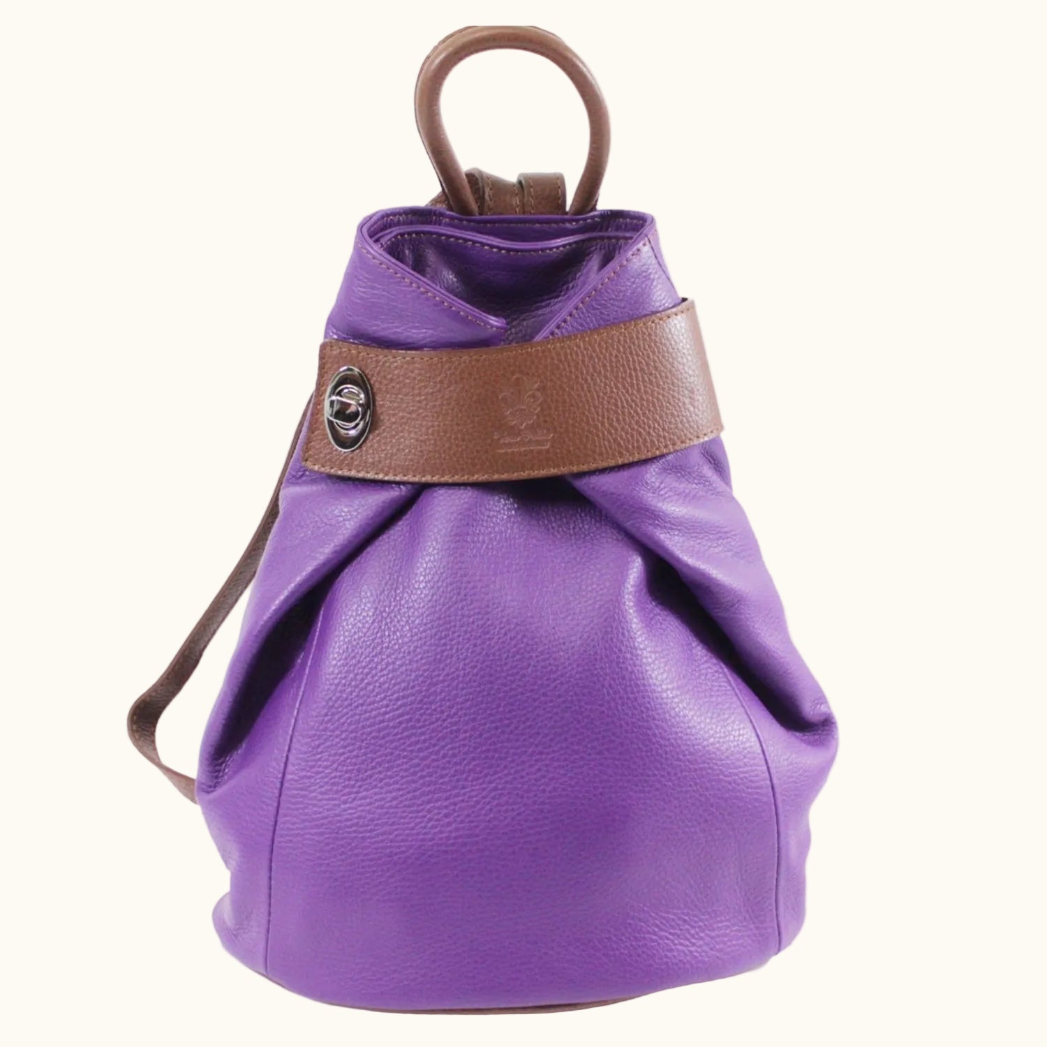 Purple leather bag with brown strap on a white background