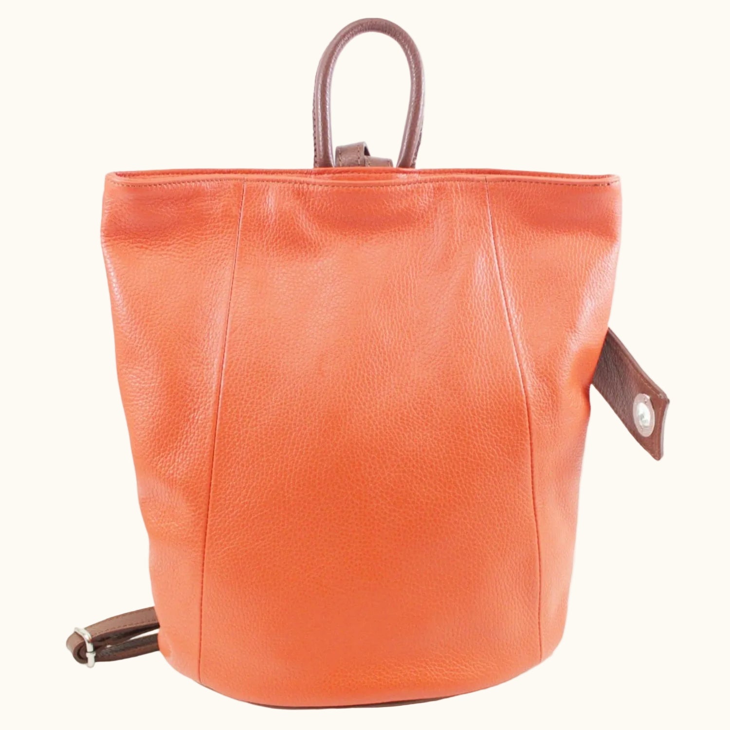 Orange leather bucket bag on a white background