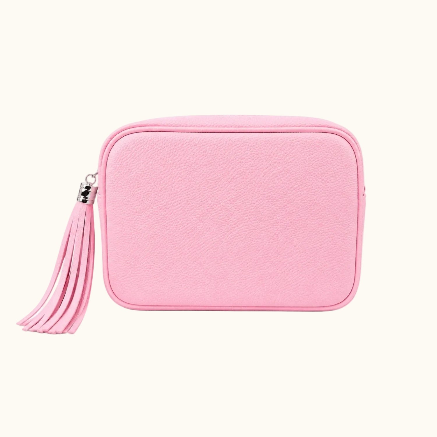 Pink pouch with a tassel on a white background
