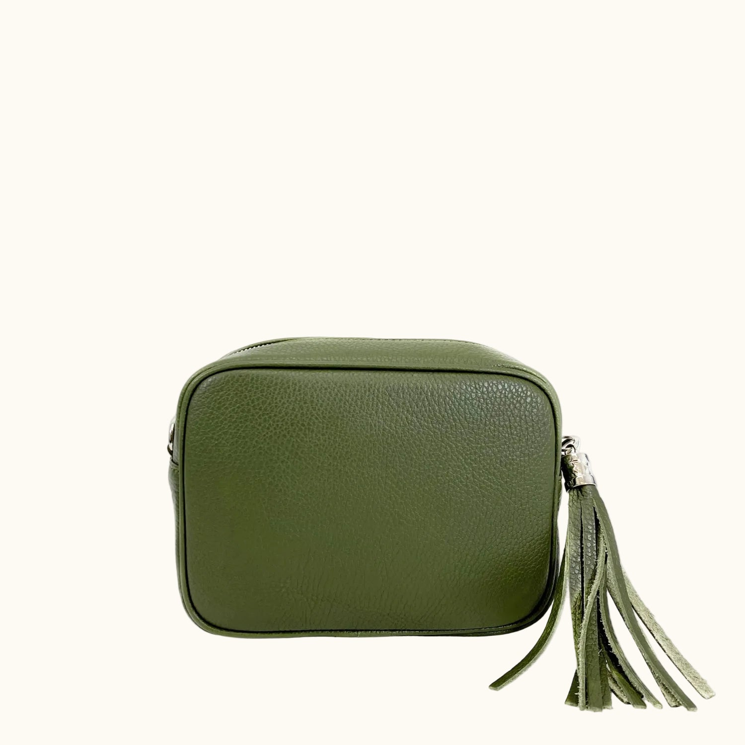 Green leather bag with a tassel on a white background