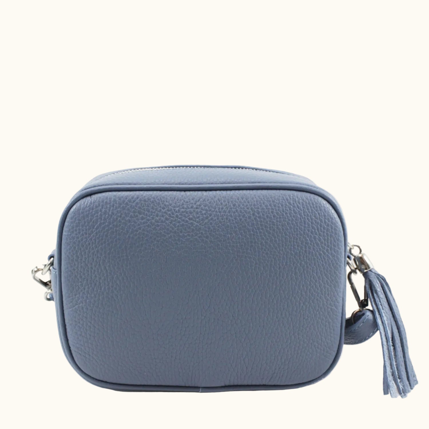 Blue crossbody bag with a tassel on a white background