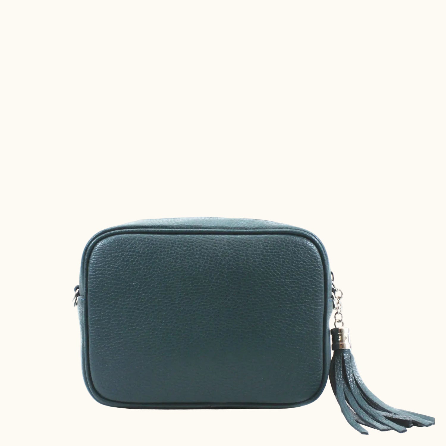 Teal leather crossbody bag with a tassel on a white background