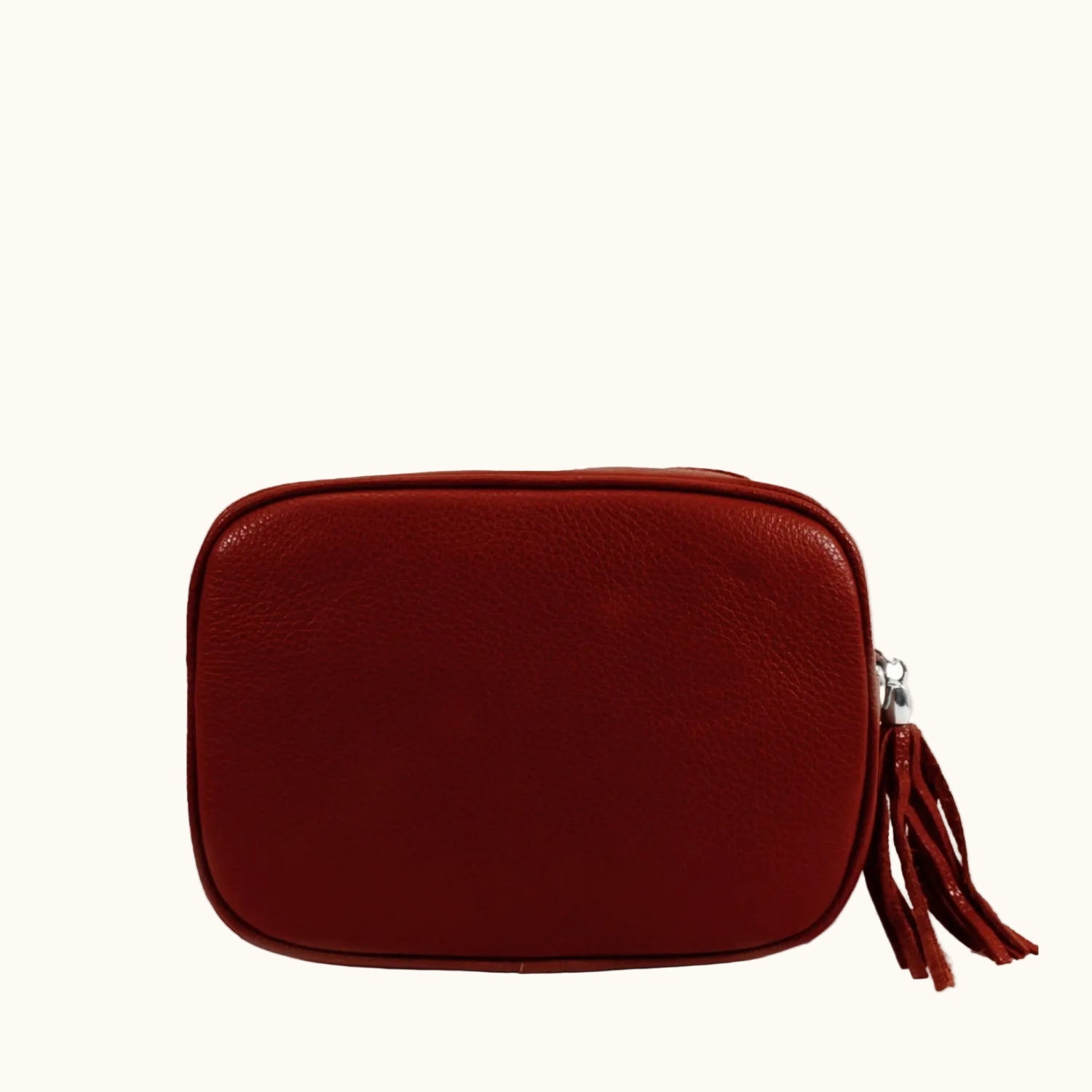 Red leather pouch with a tassel on a white background