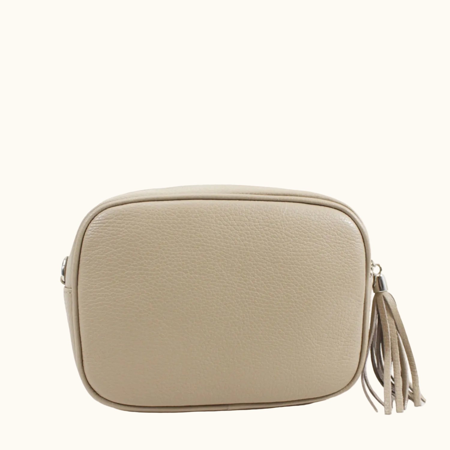 Beige handbag with a tassel on a white background