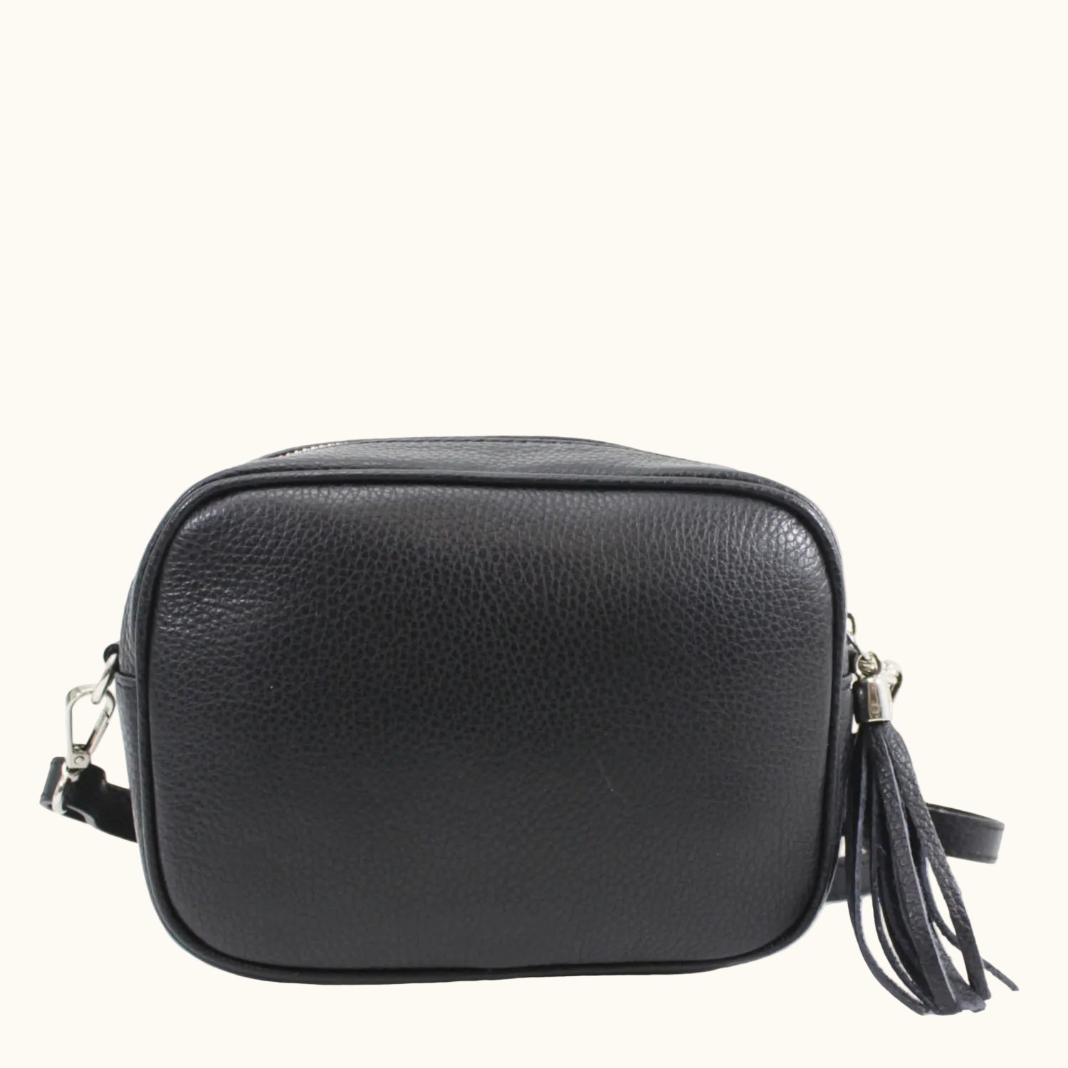Black leather crossbody bag with a tassel on a white background