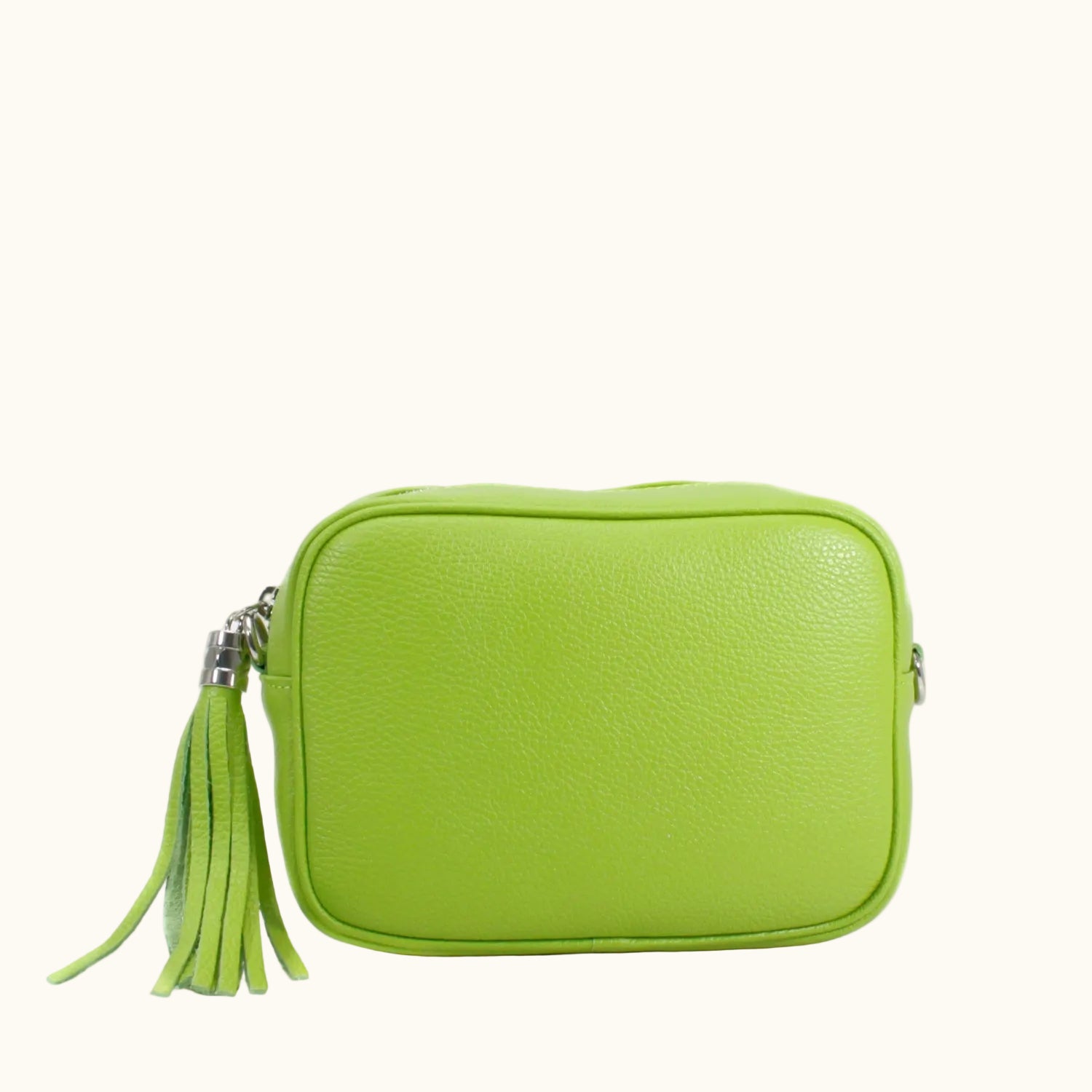 Green leather bag with a tassel on a white background